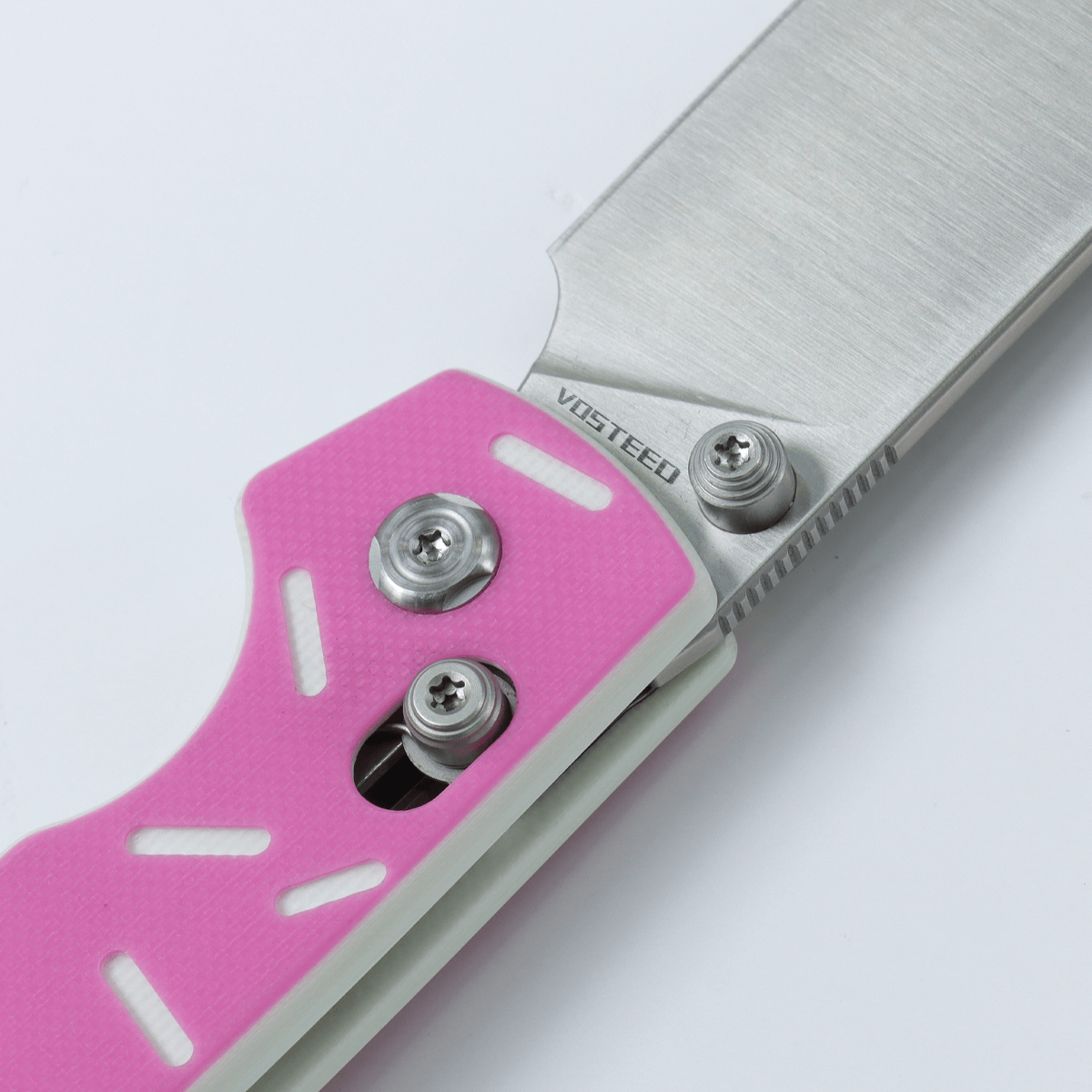 Vosteed Raccoon Crossbar Knife detail, pink handle, Vosteed logo