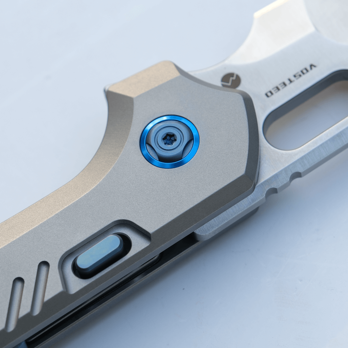 Vosteed RSKAOS knife detail: Blue Hardware & Titanium Handle