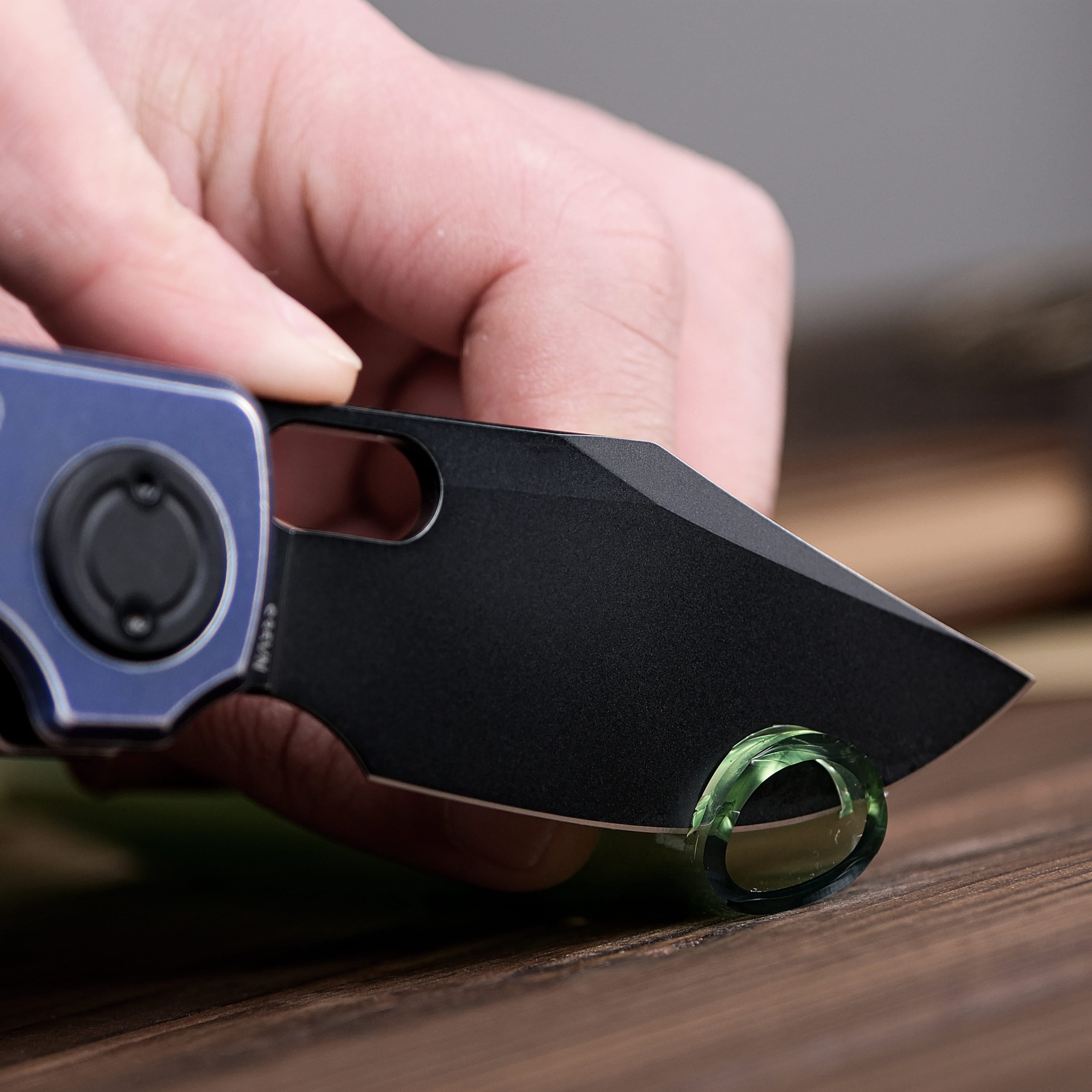 Vosteed Akita knife cutting something, S35VN Bowie blade