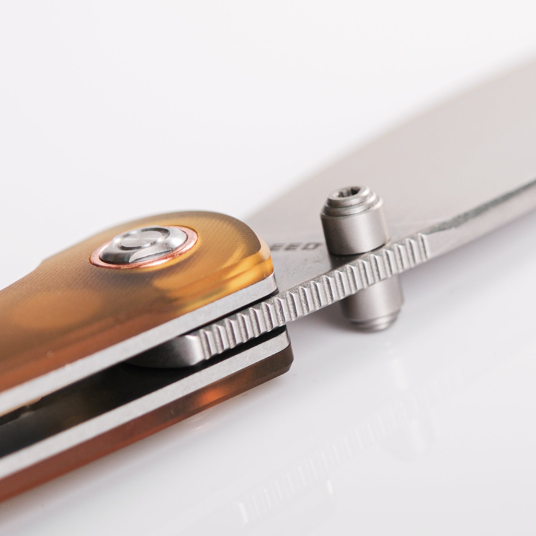 Large Nightshade knife detail: blade and amber Ultem handle