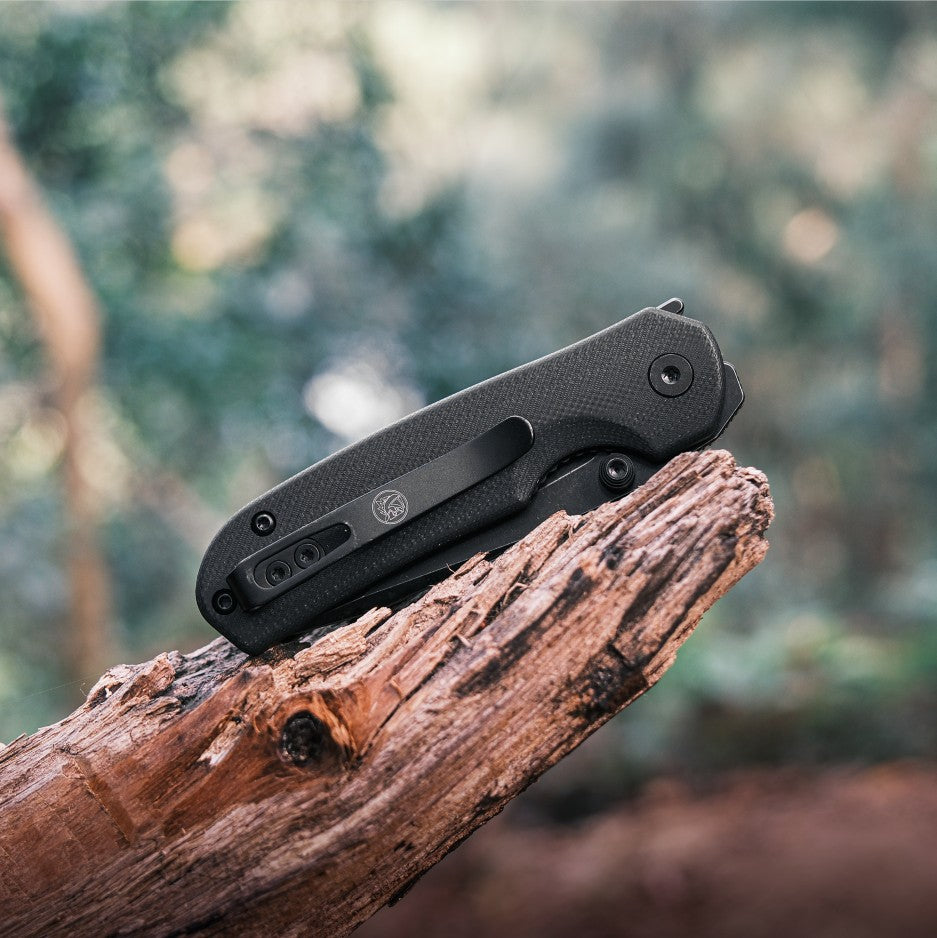 Black Vosteed Chipmunk EDC knife on wood