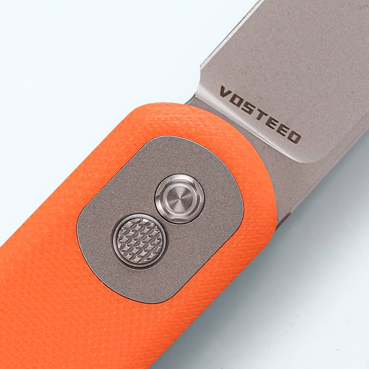 Vosteed Corgi knife with Trek Lock button and blade detail