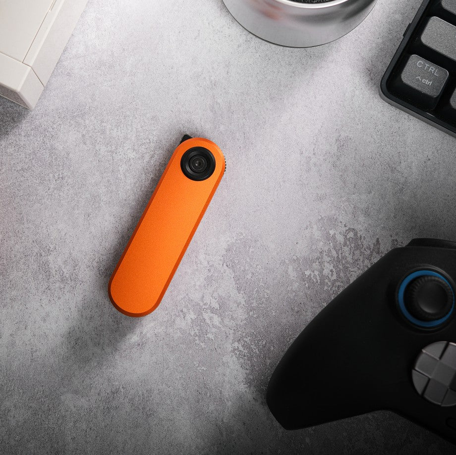 Vosteed Corgi V knife on a grey surface.