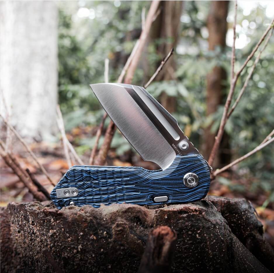 Vosteed Hedgehog knife on a stump, blade open