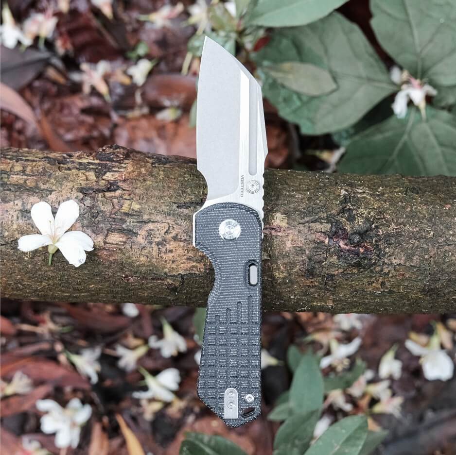 Vosteed Hedgehog knife open on branch, S35VN blade