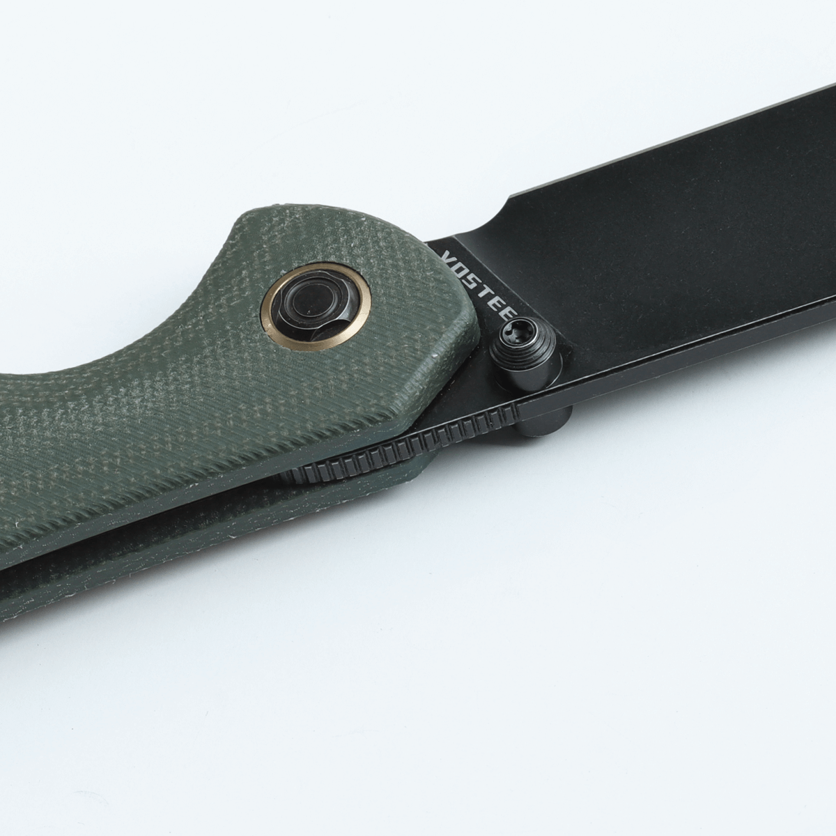 Vosteed Labrador knife detail: Micarta handle, black blade, VOSTEED logo