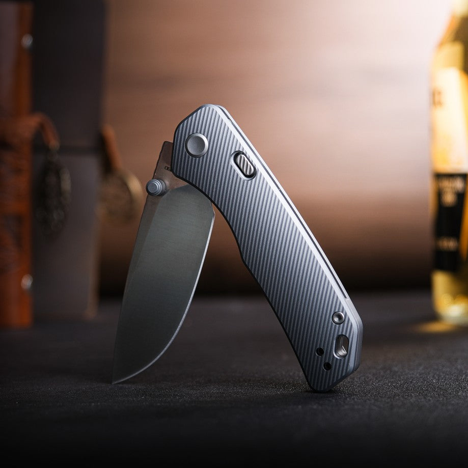 Vosteed Marten knife with drop-point blade open, gray handle