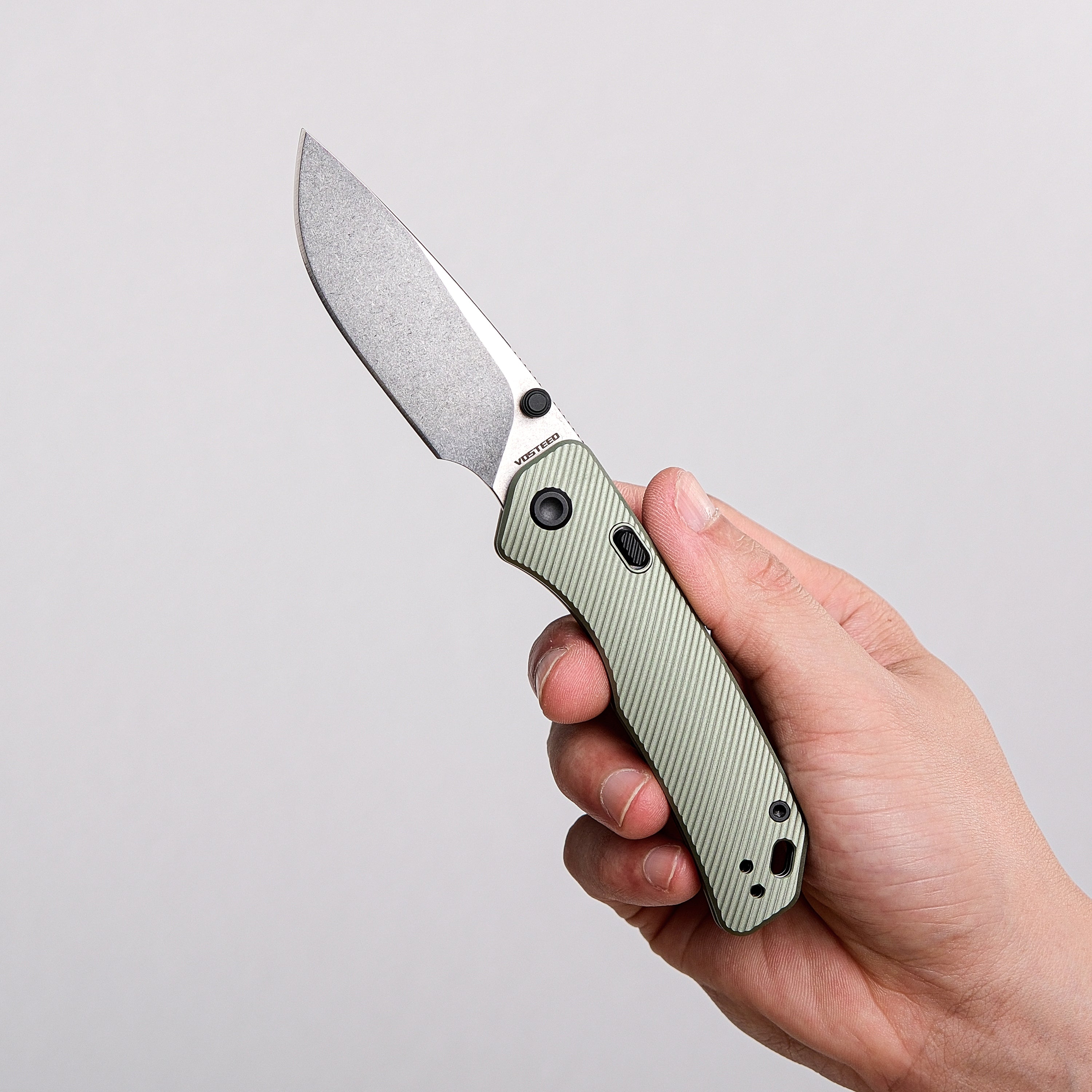 Vosteed Marten EDC Knife held in hand, drop-point blade