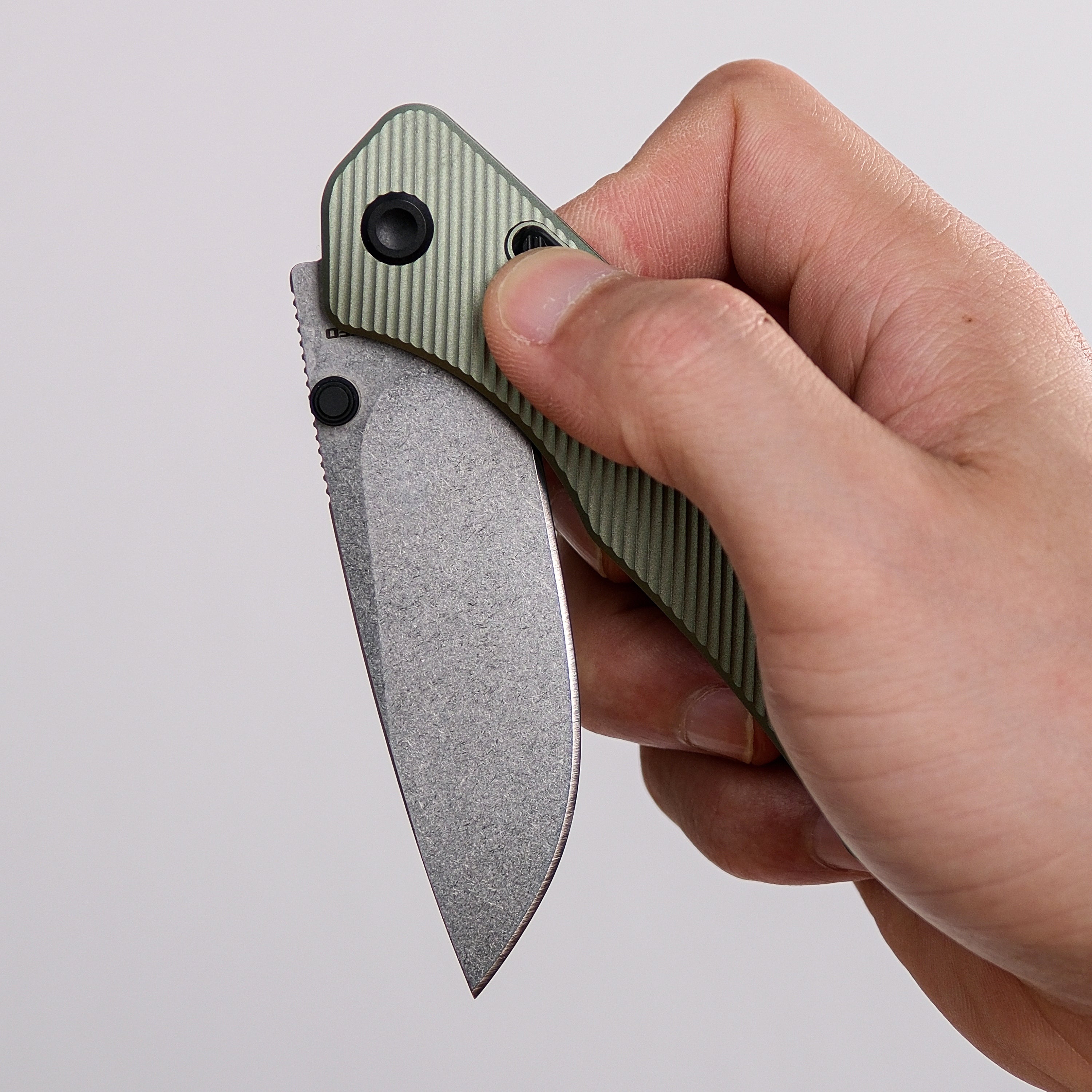 Vosteed Marten EDC knife held, revealing drop point blade.