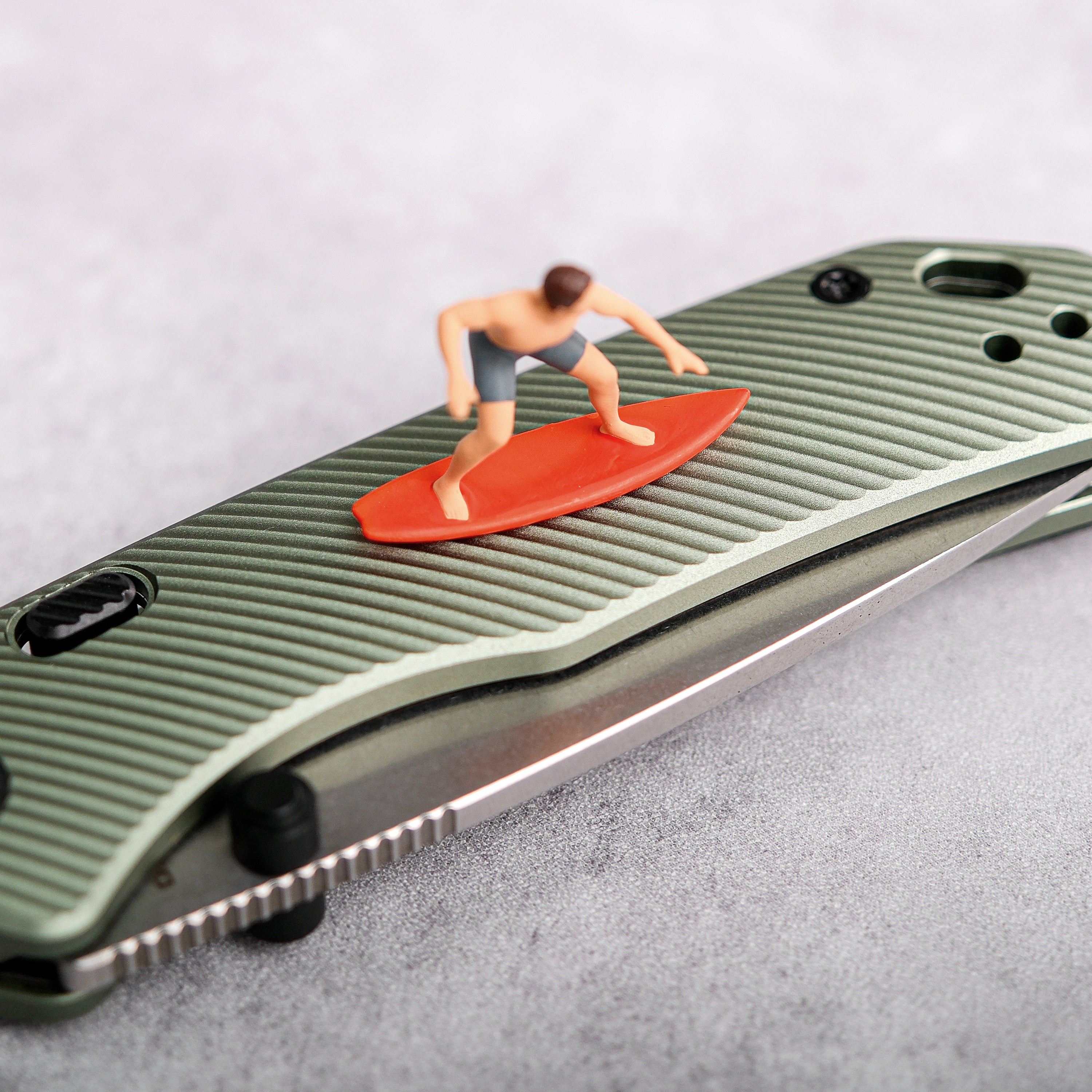 Vosteed Marten knife with surfer figure, micro-milled aluminum handle