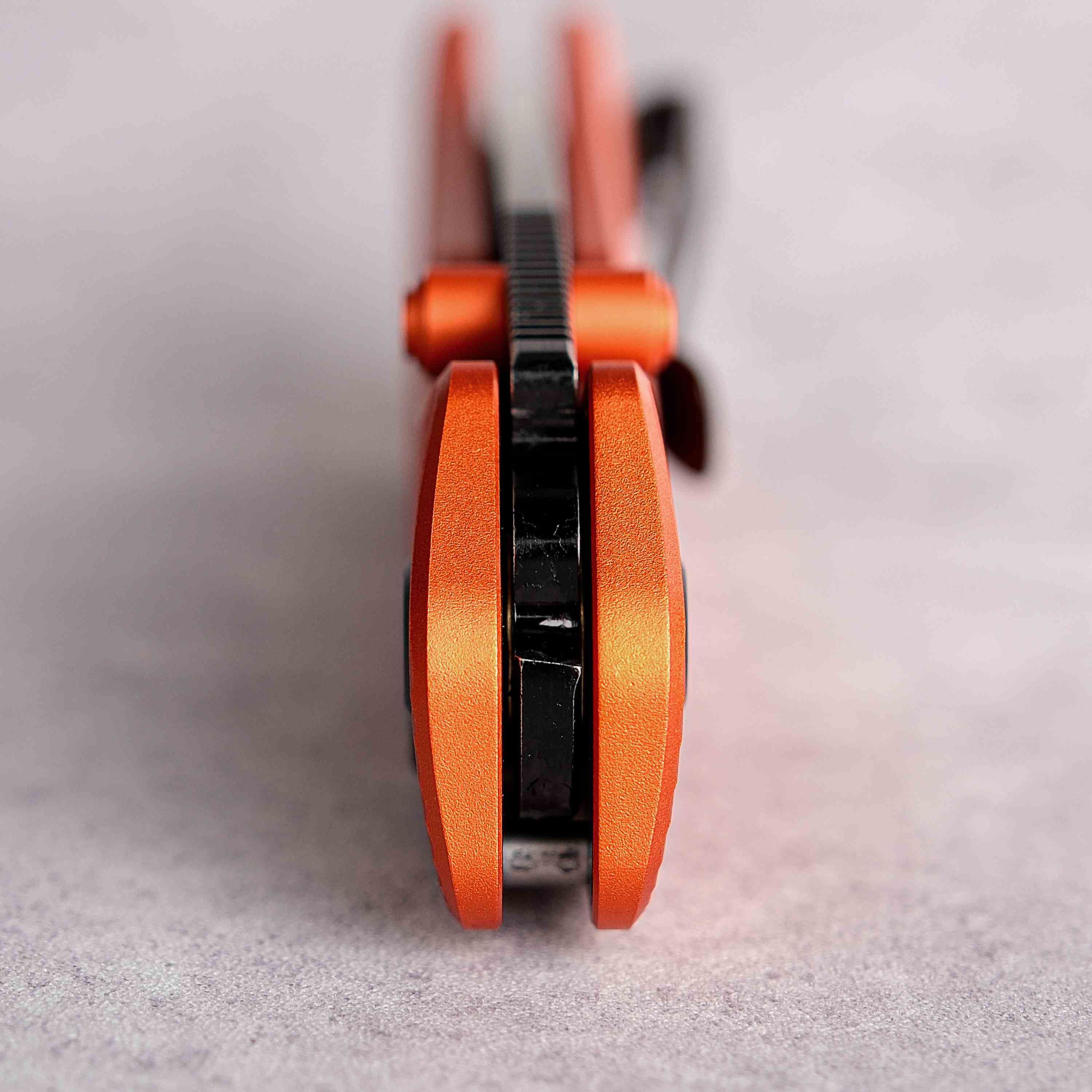 Vosteed Marten knife, Orange aluminum handle close-up