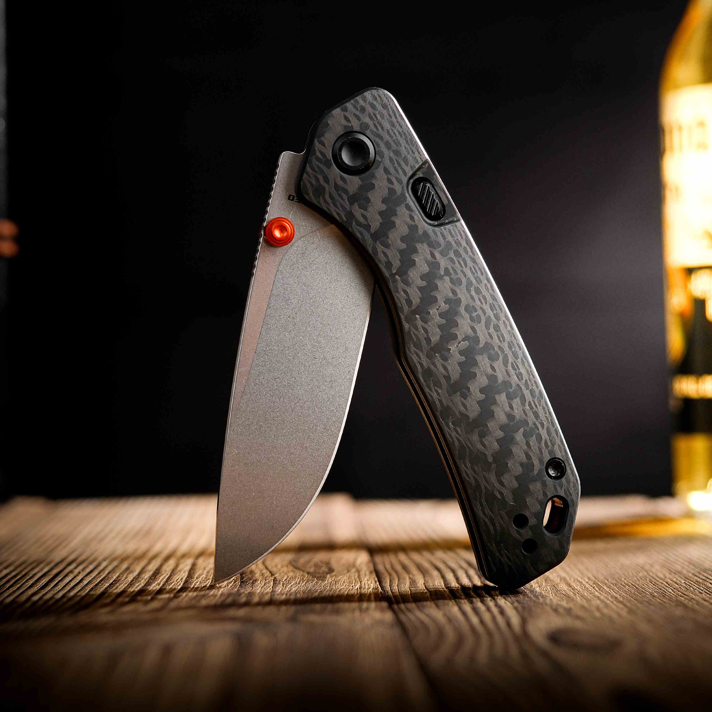 Vosteed Marten knife open on a wooden surface