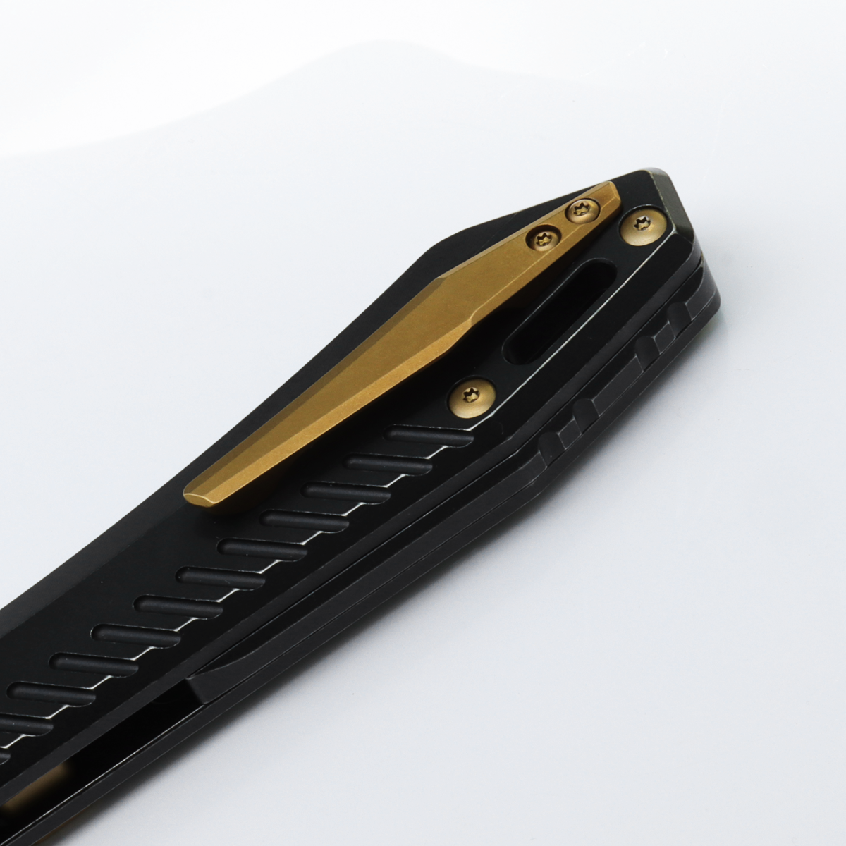 Vosteed RSKAOS knife, close-up of pocket clip and titanium handle
