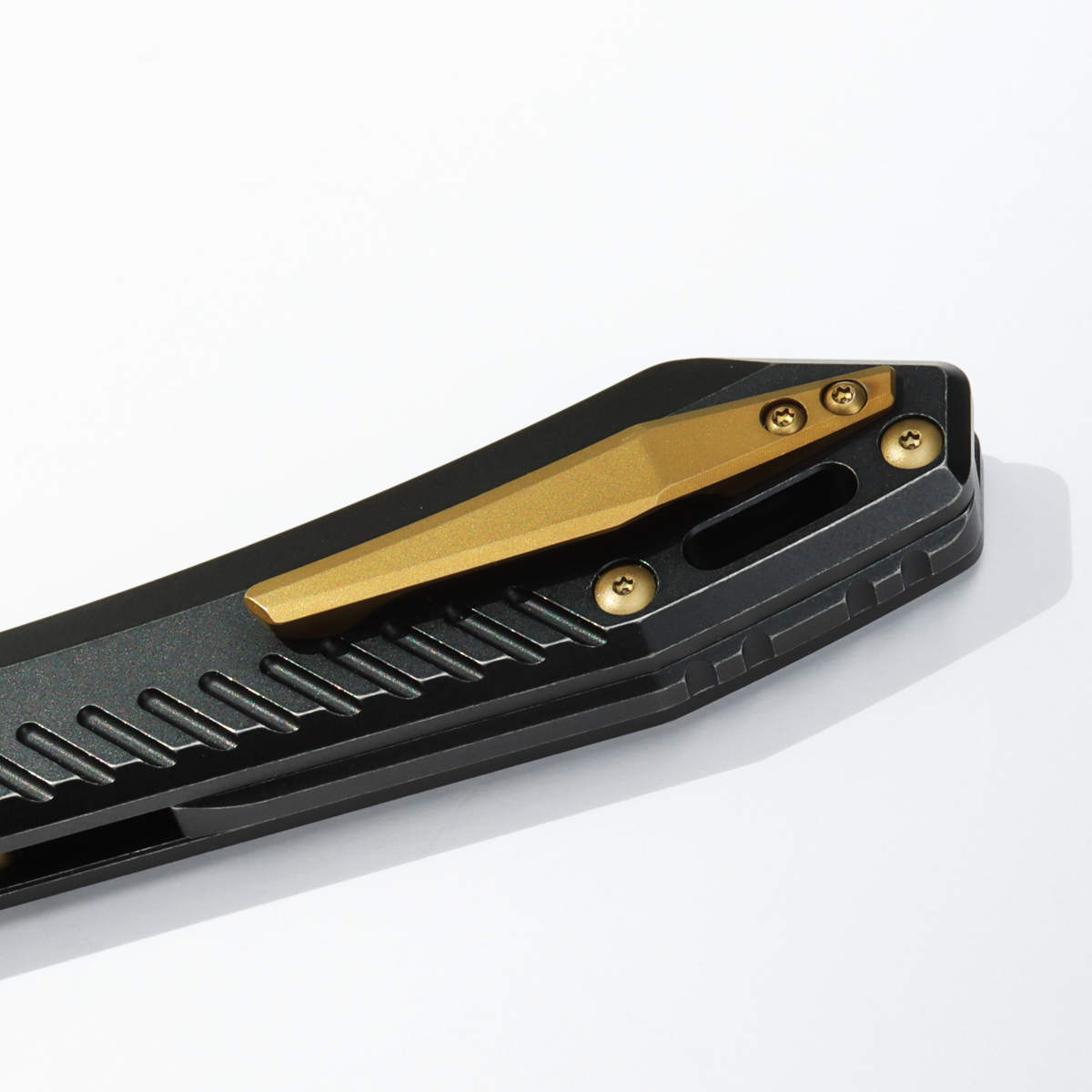 Vosteed RSKAOS knife detail: Titanium clip, Black Handle, Yellow Hardware