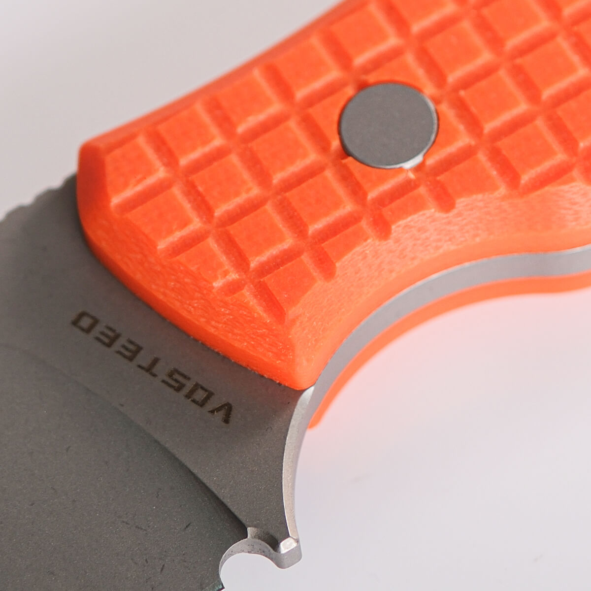 Vosteed Mink knife blade detail, orange G10 handle