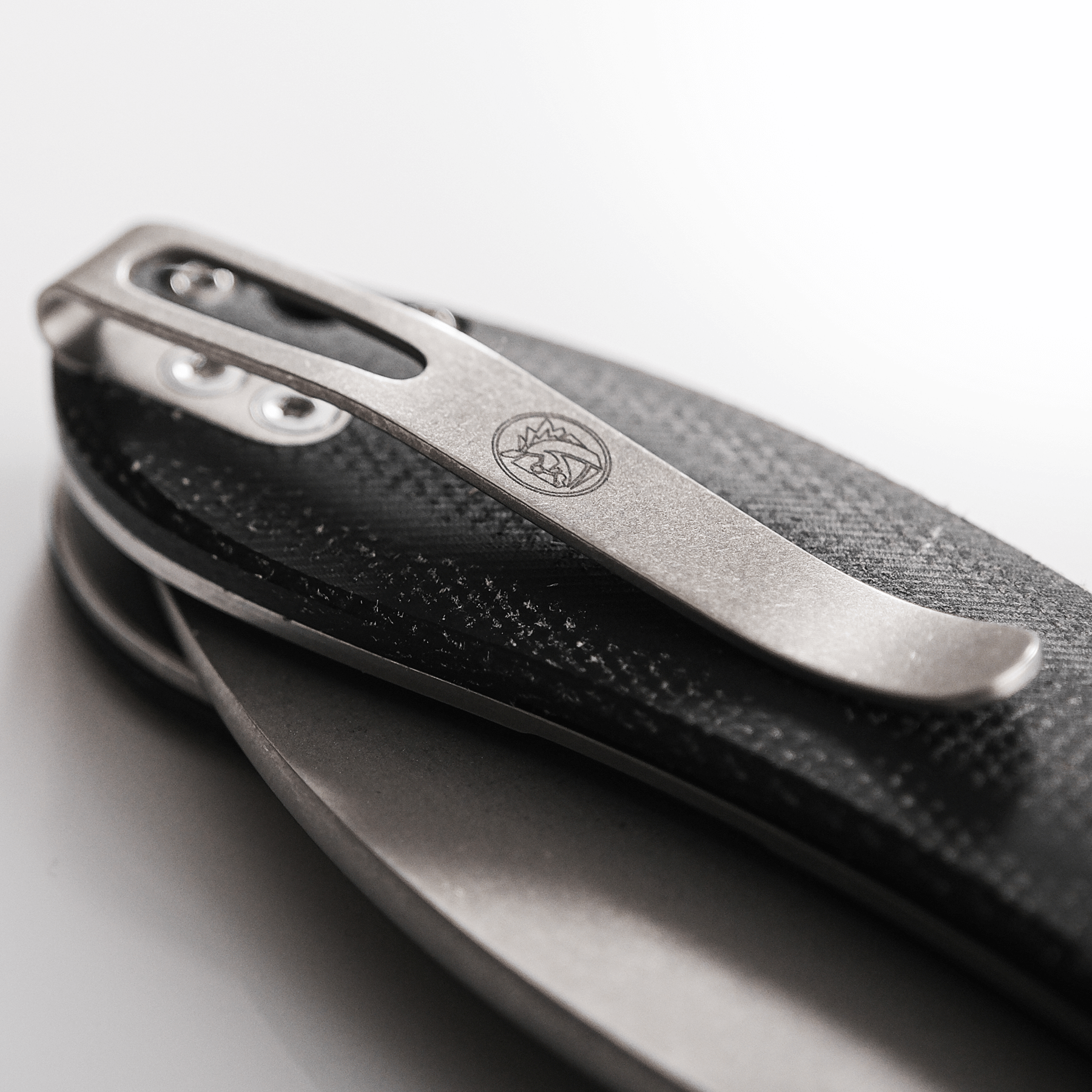 Vosteed Nightshade knife detail: titanium pocket clip close-up