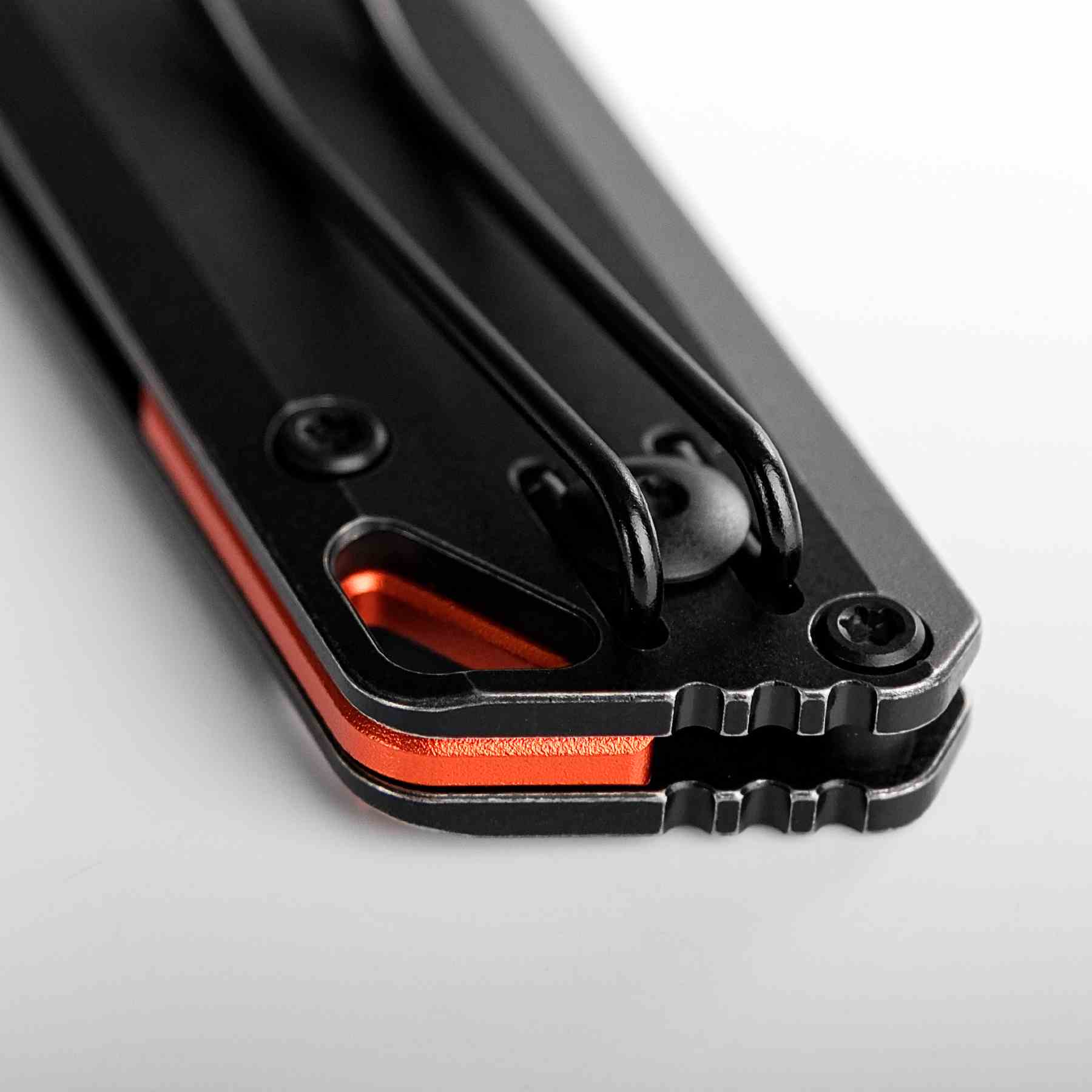 Vosteed Parallel knife detail: clip, handle, and orange accents