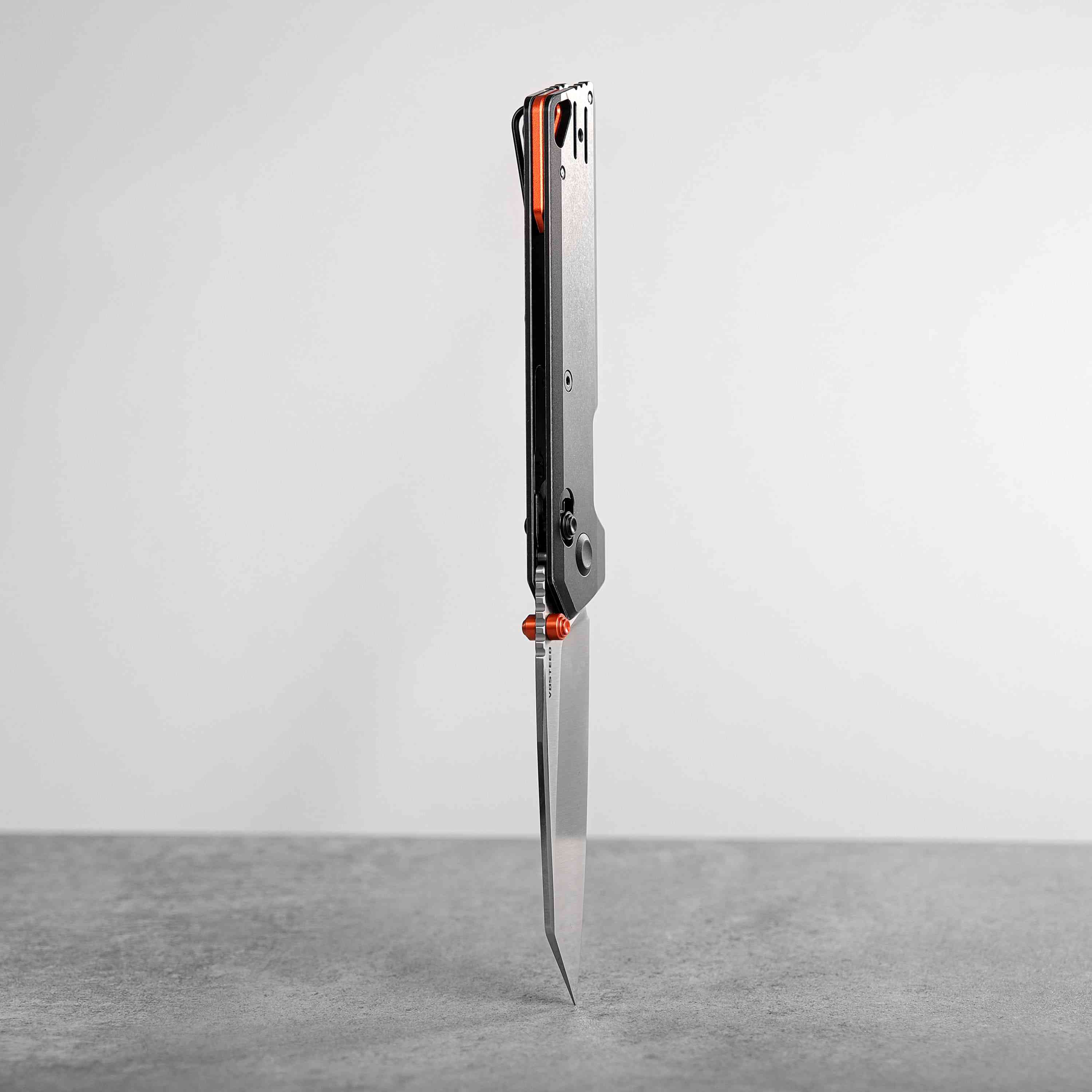 Vosteed Parallel knife profile, orange accents and titanium handle