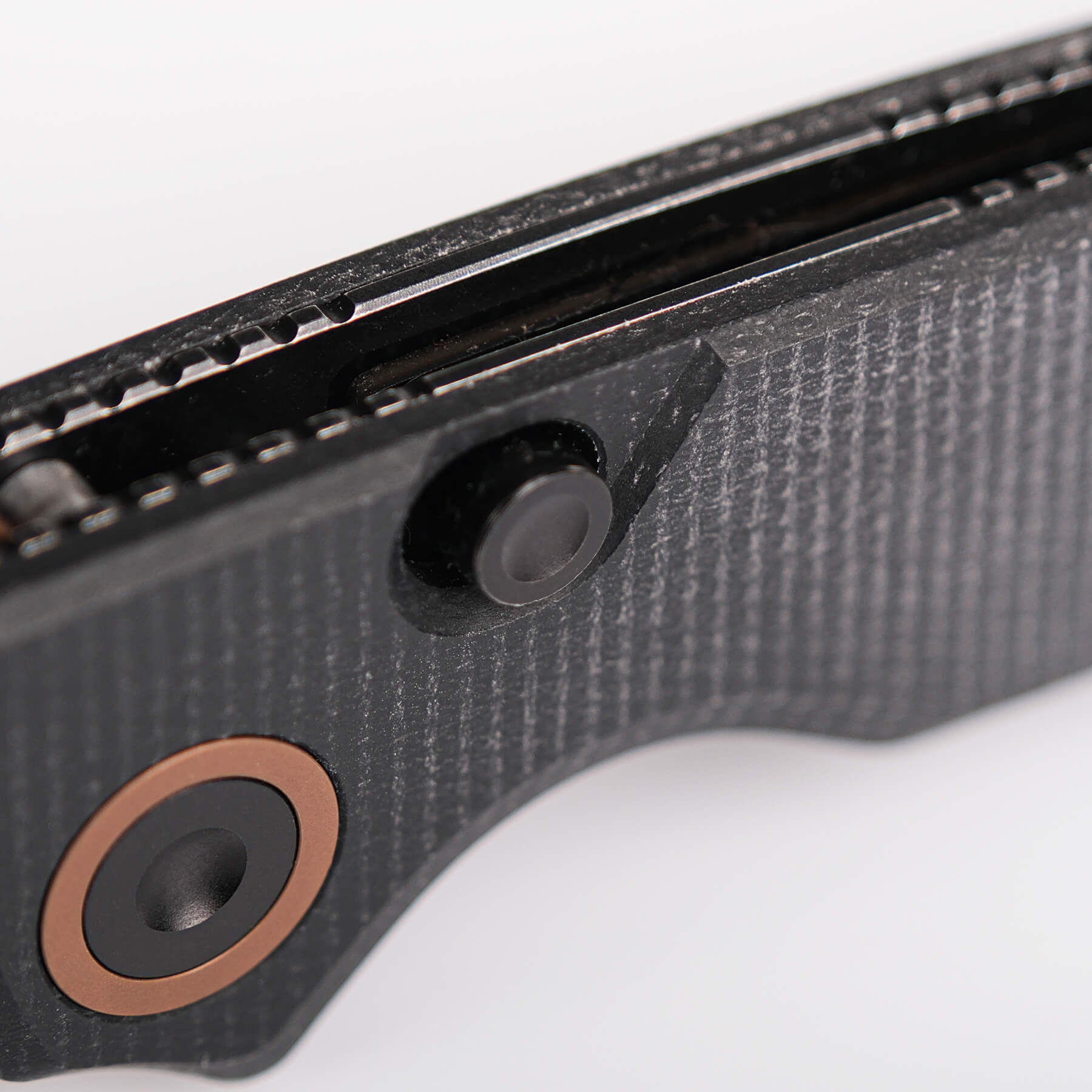 Vosteed Porcupine knife: Close-up of Micarta handle detail and button.