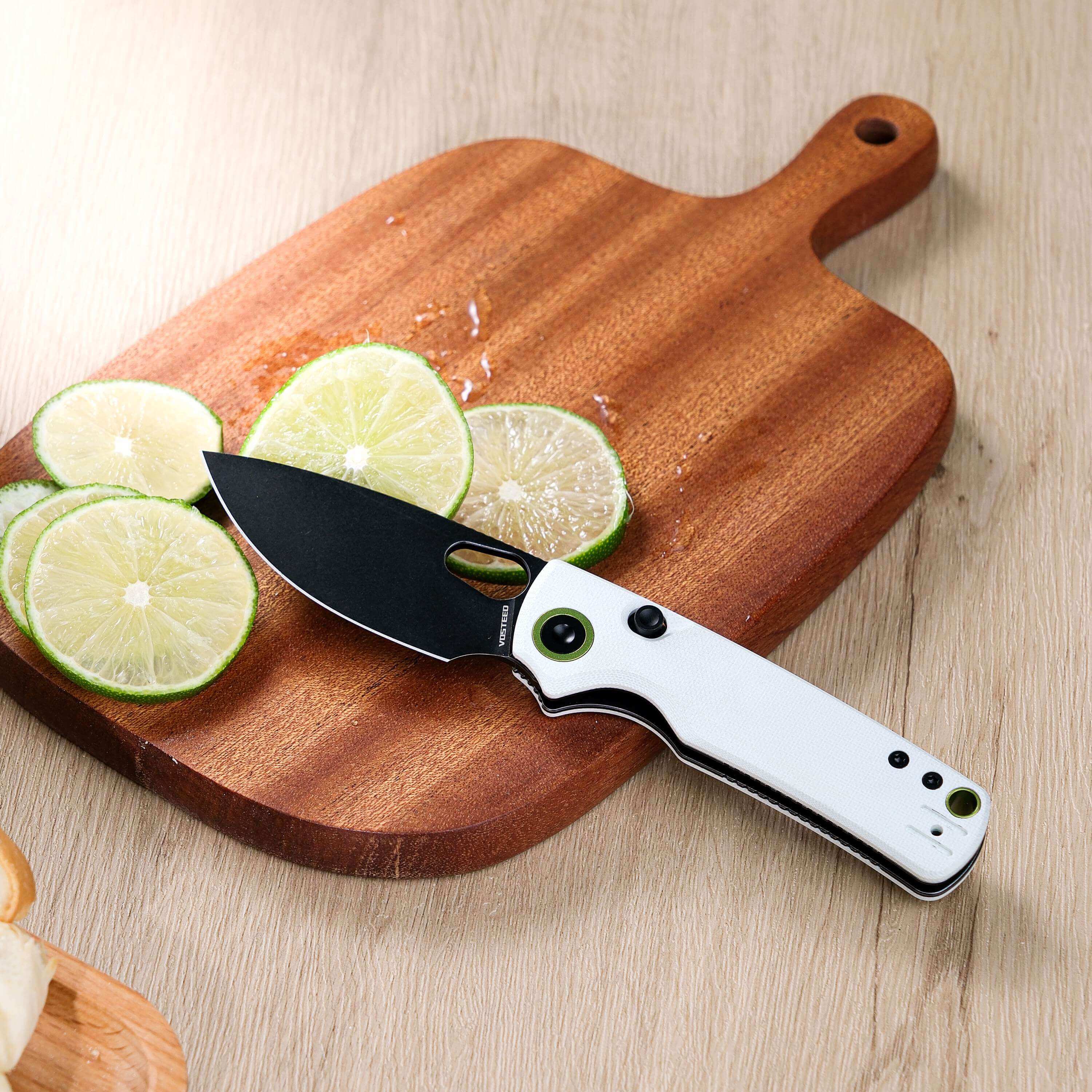 Vosteed Porcupine knife slicing limes on cutting board