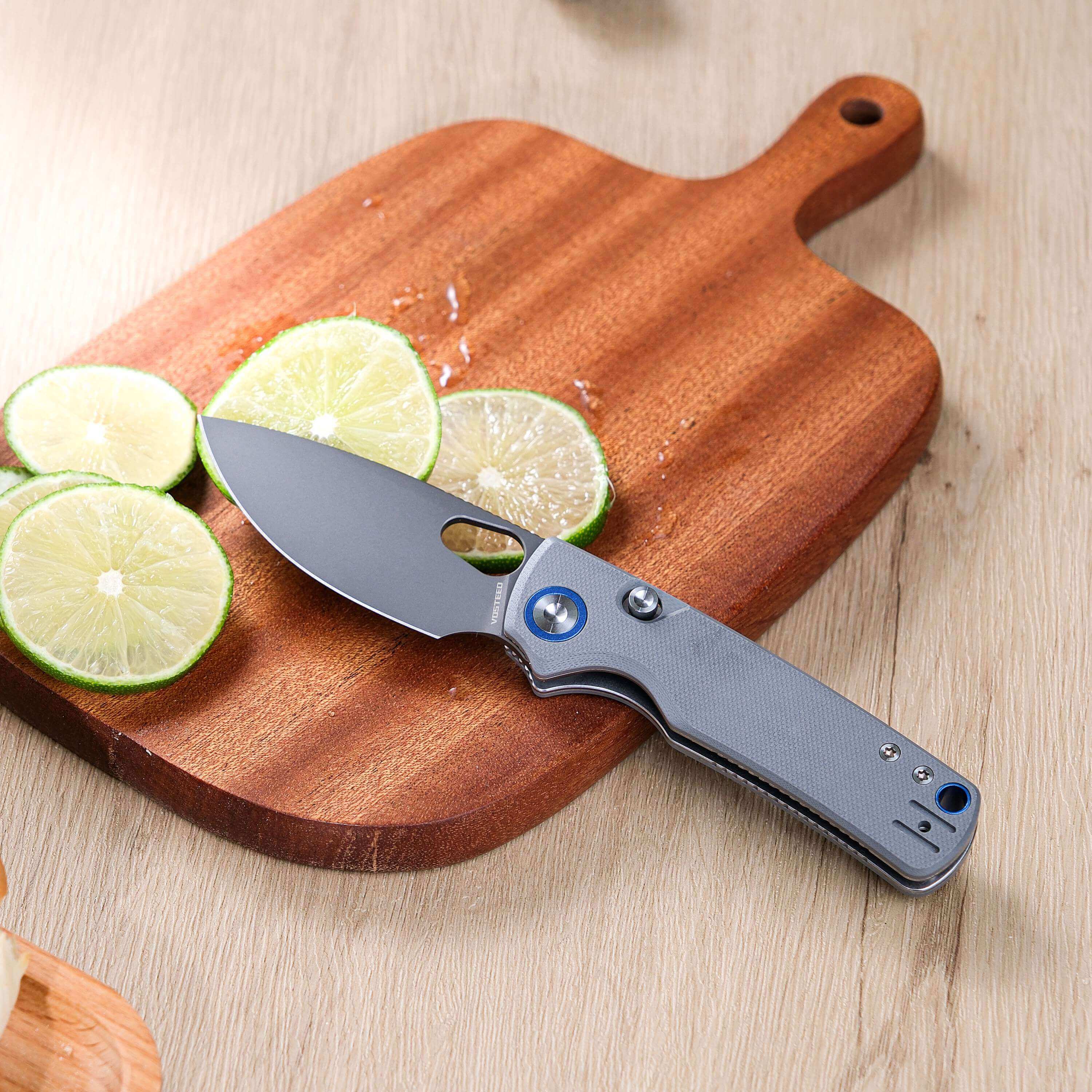 Vosteed Porcupine knife cutting lime on a wooden board