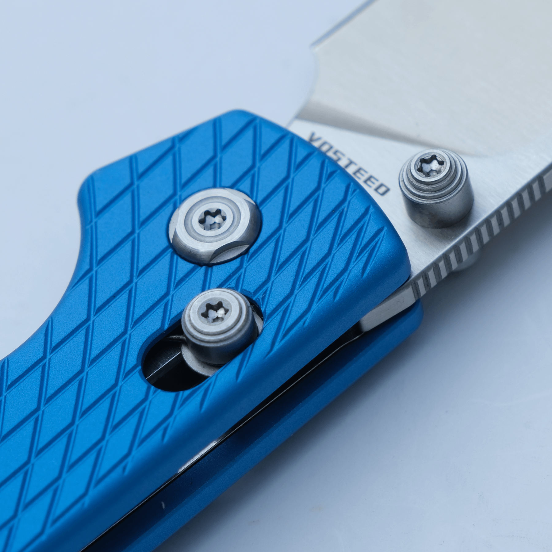 Vosteed Raccoon knife detail, blue handle and blade
