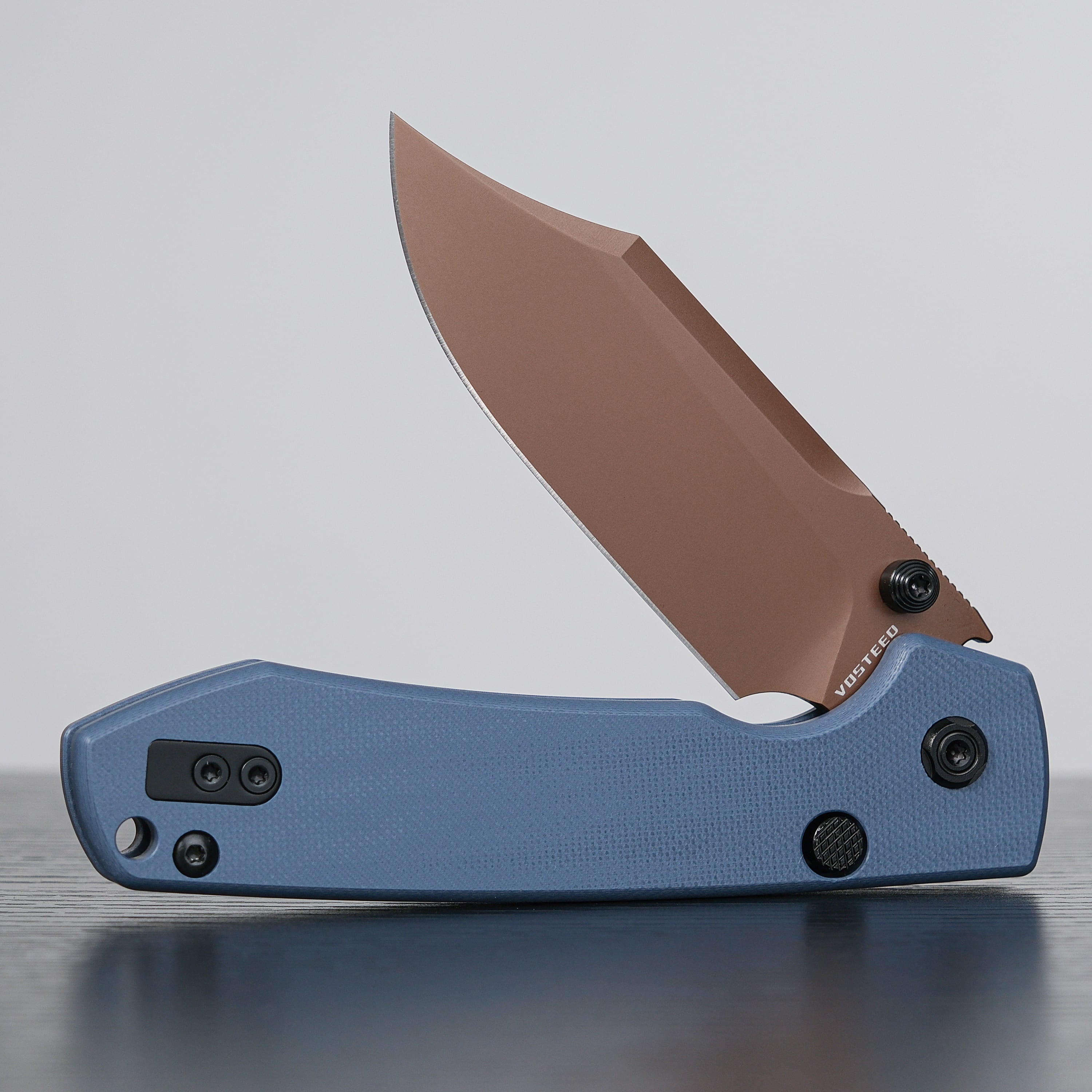Vosteed Raccoon Knife: Bowie blade open, dark blue handle