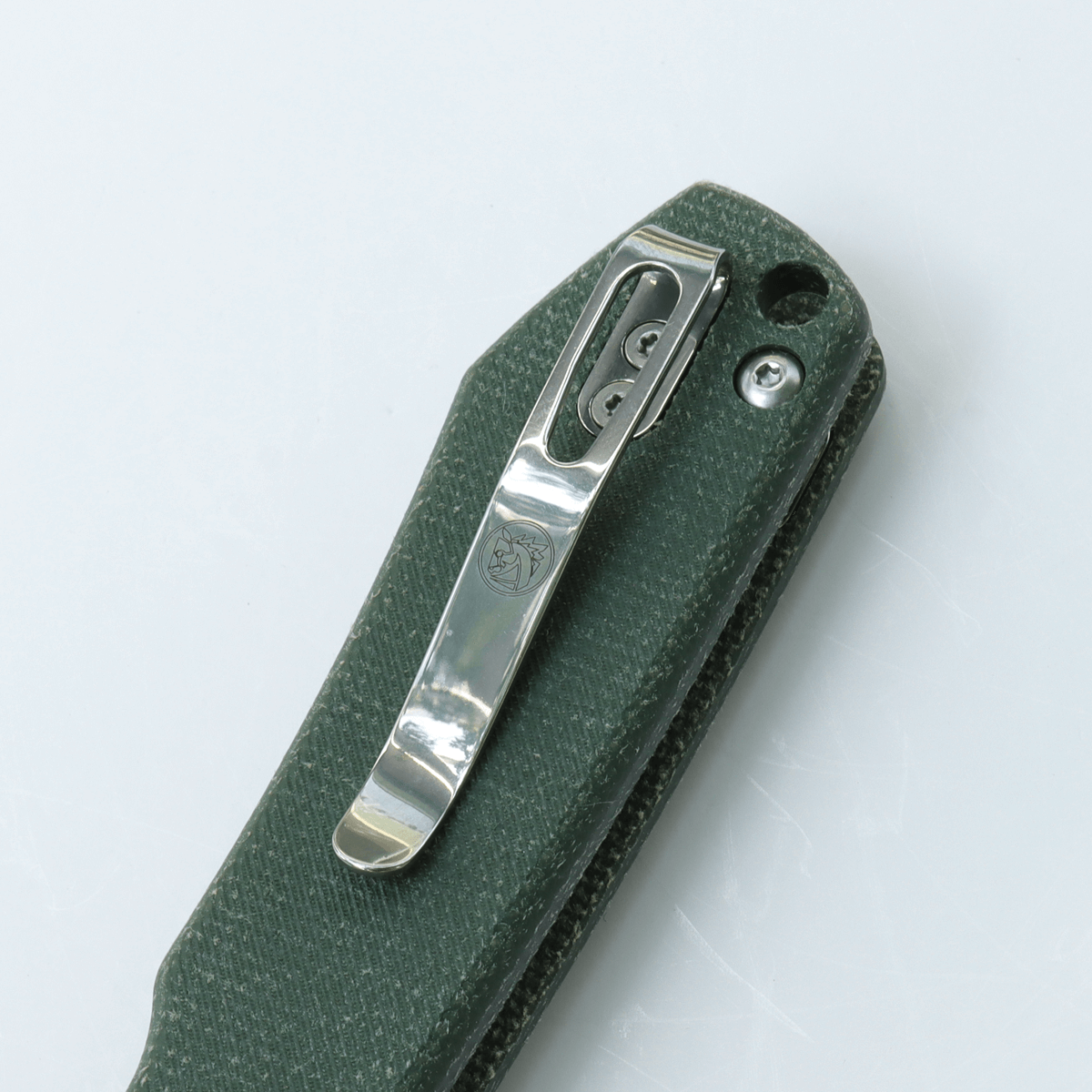 Vosteed Raccoon knife clip detail, green Micarta handle