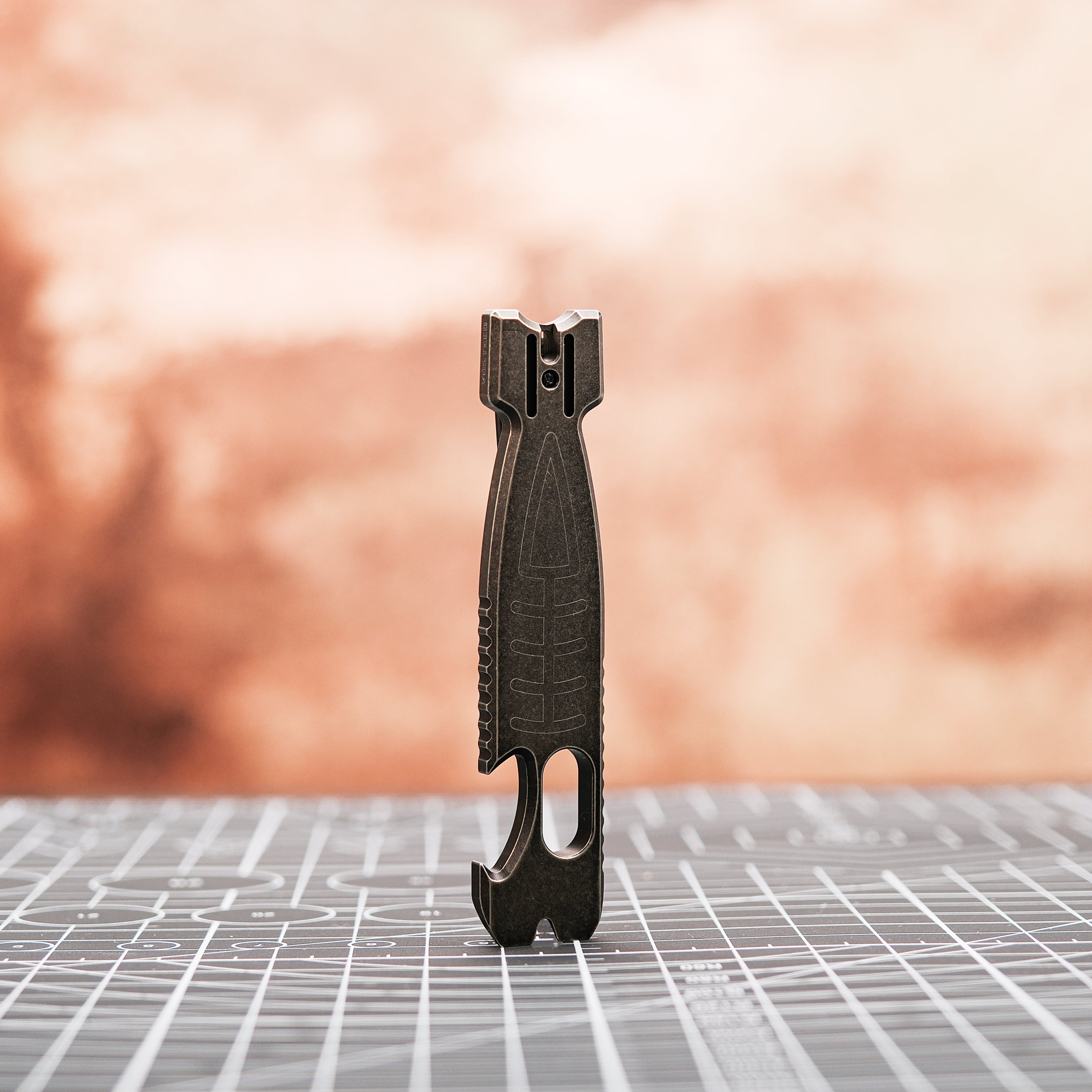 Shark Bomb Prybar-X0118 on grid, featuring bottle opener