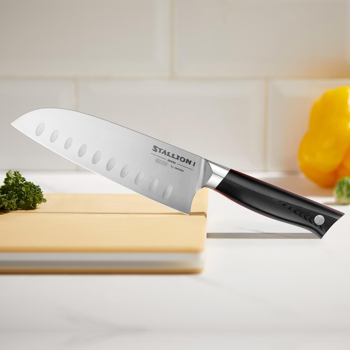Stallion I Series Santoku Knife on cutting board
