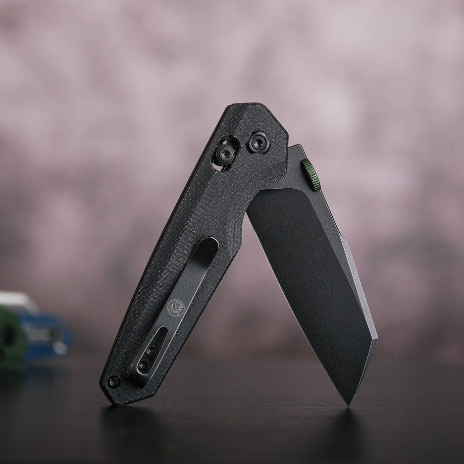 Vosteed Tala black knife with crossbar lock, Micarta handle, thumb disk