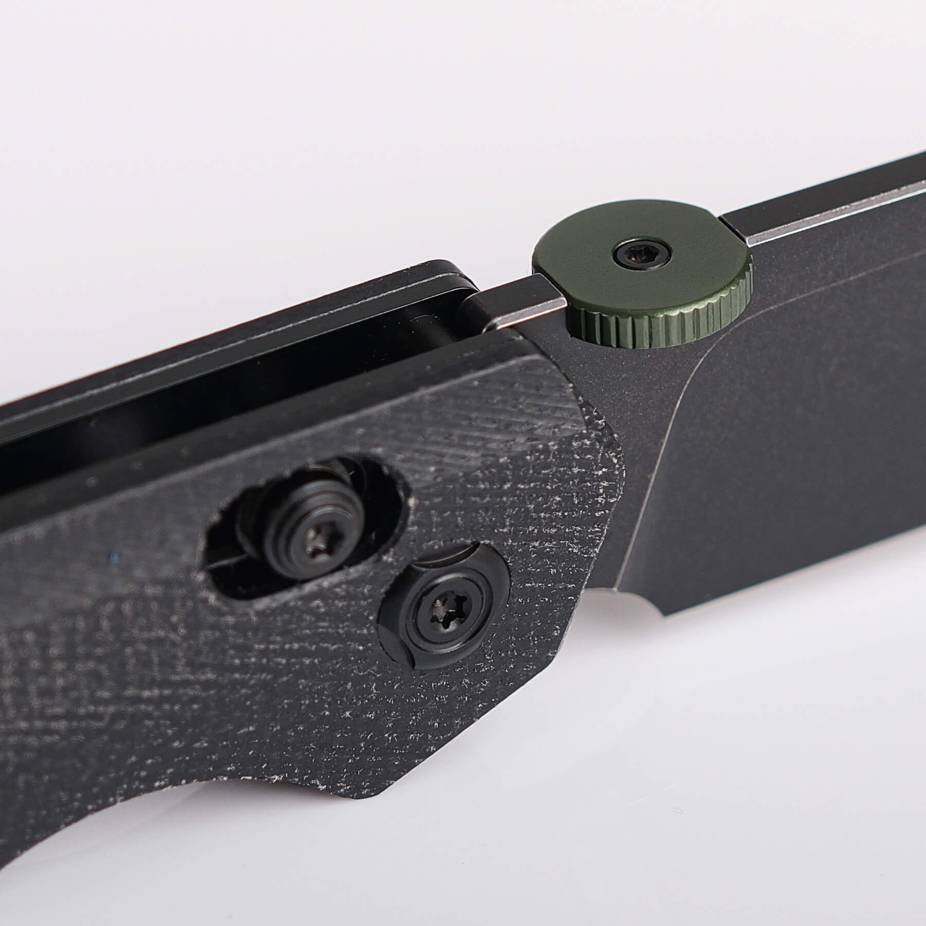 Vosteed Tala Knife - Close-up: Micarta handle detail, thumb disk
