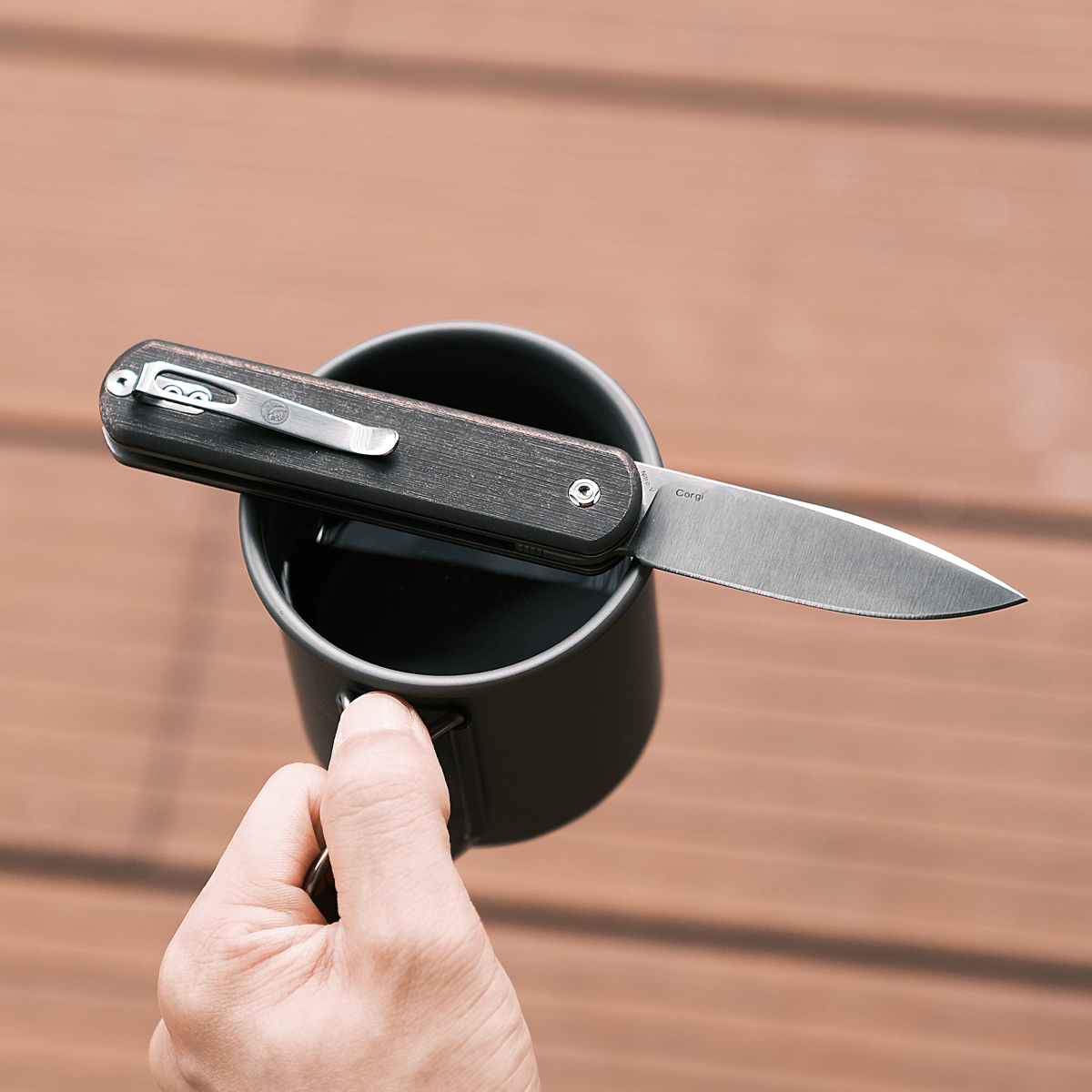 Vosteed Corgi knife resting on a cup