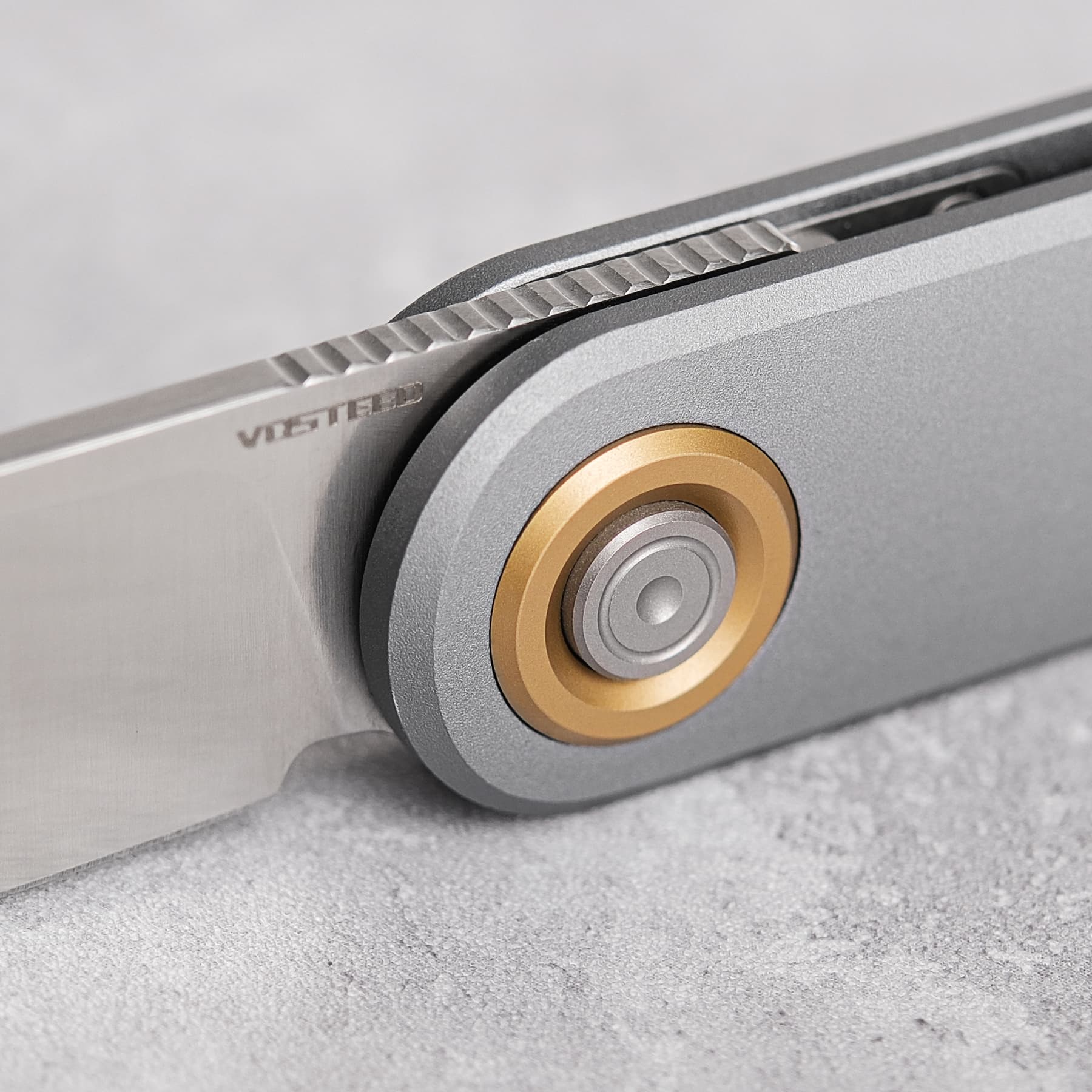 Vosteed Corgi V knife blade detail and button