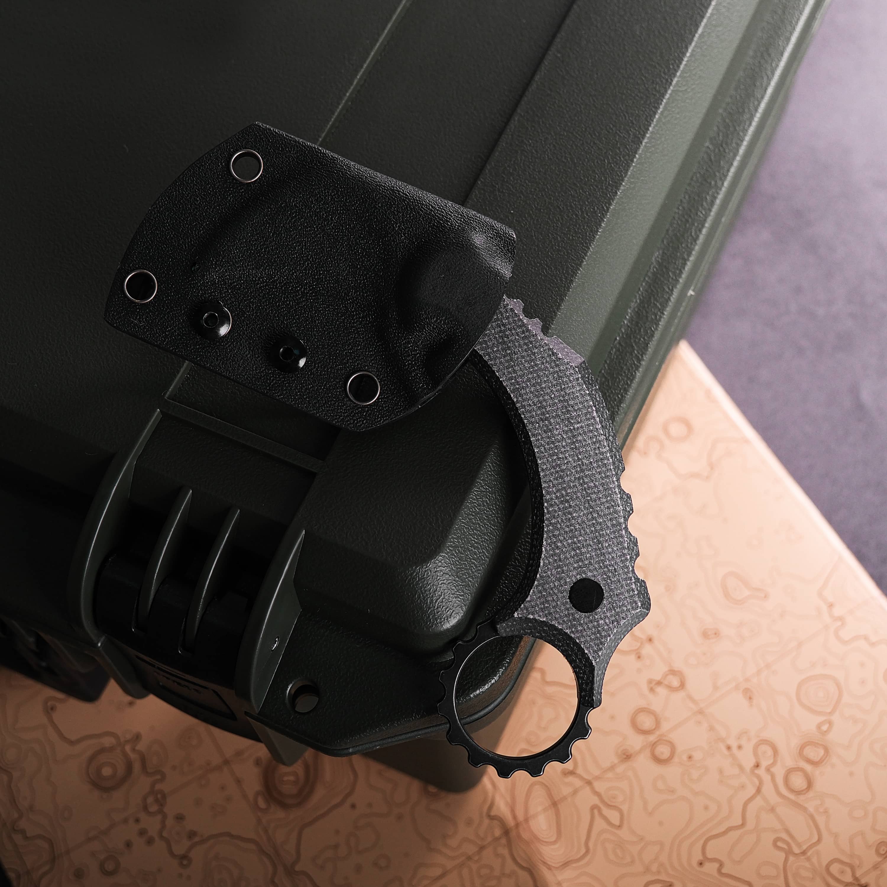 Dirty Girl Karambit knife and sheath on case