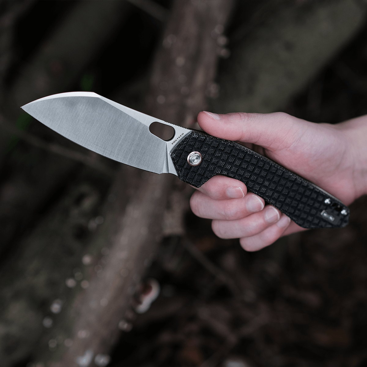 Vosteed Gator knife held open, sheepsfoot blade
