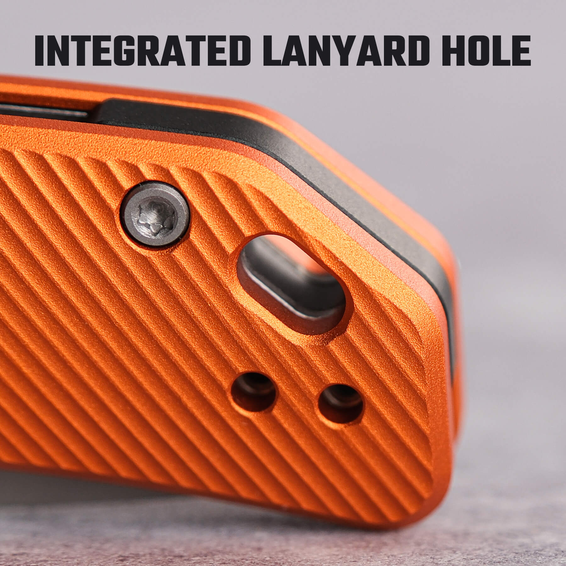 Vosteed Marten Knife Detail - Integrated Lanyard Hole and Orange Aluminum Handle