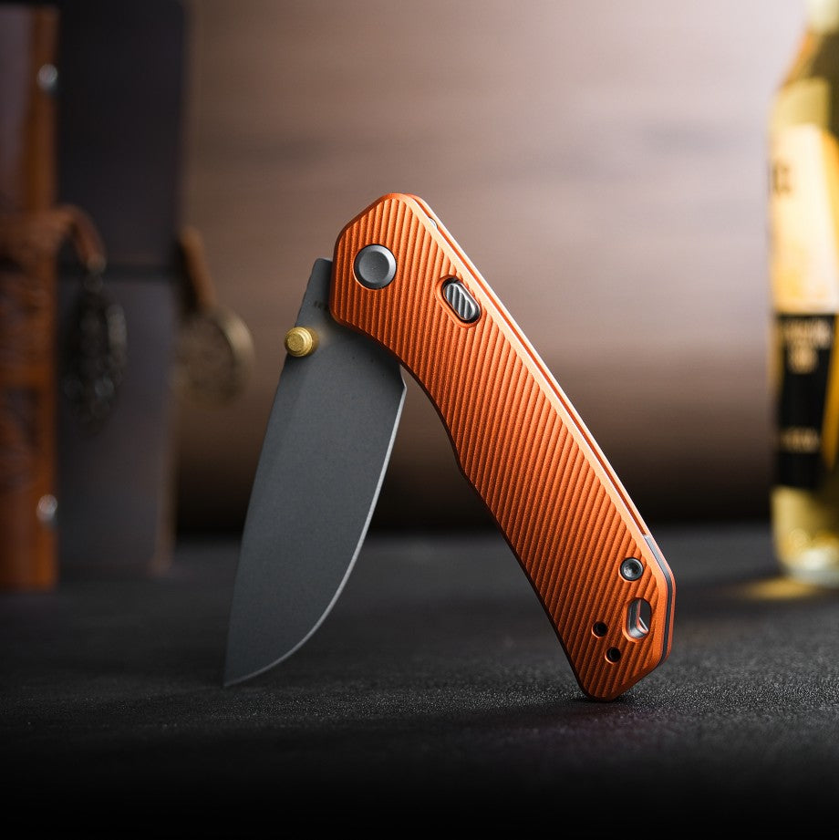 Vosteed Marten knife with orange aluminum handle, drop point blade