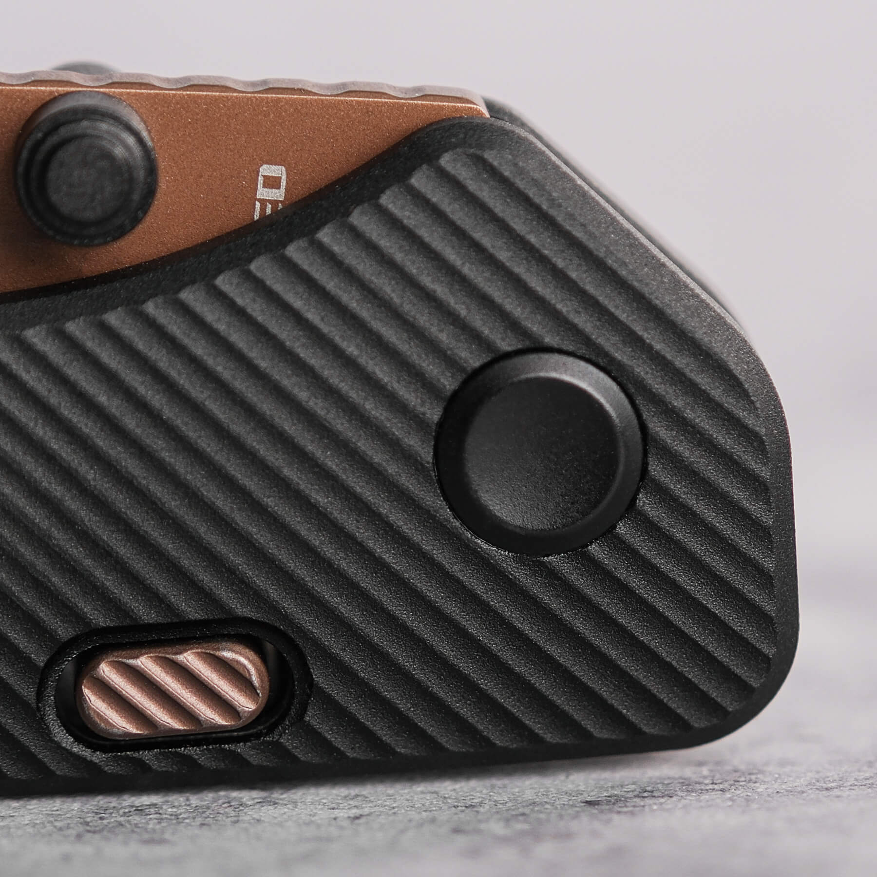 Vosteed Marten knife handle detail, black aluminum, copper accent