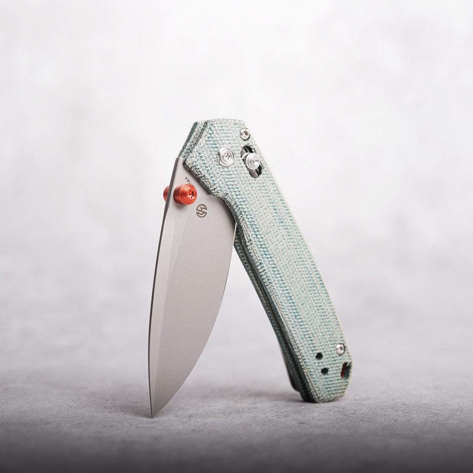 Vosteed Mini Psyop knife open, teal Micarta handle