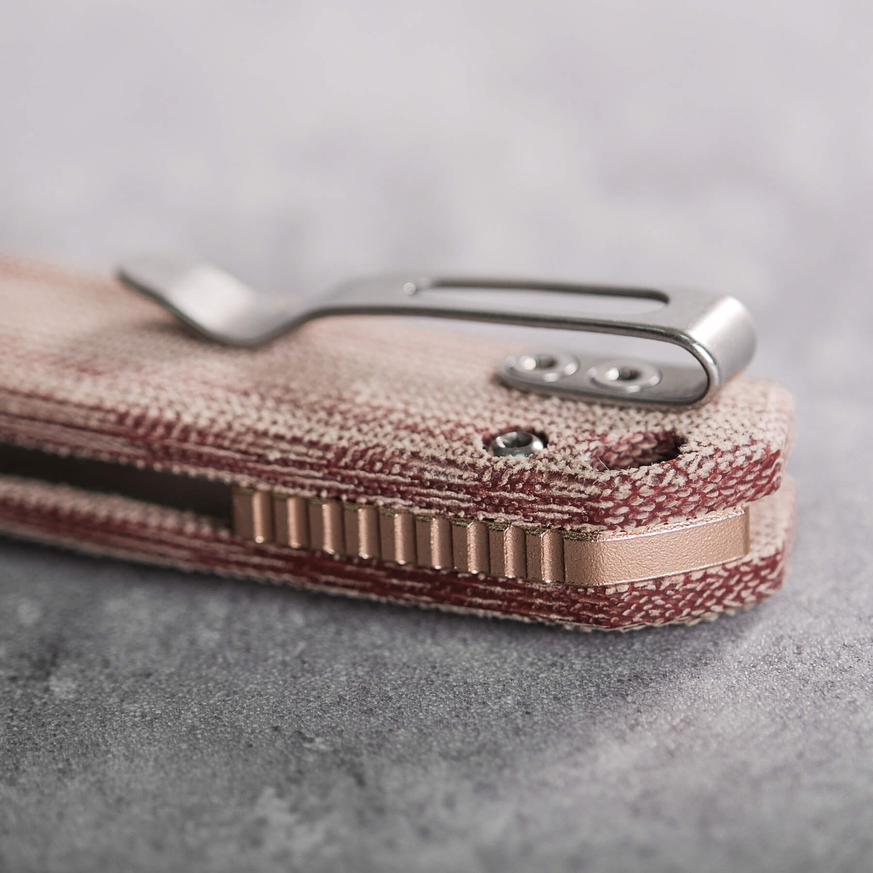 Mini Psyop Red Micarta handle detail, pocket clip
