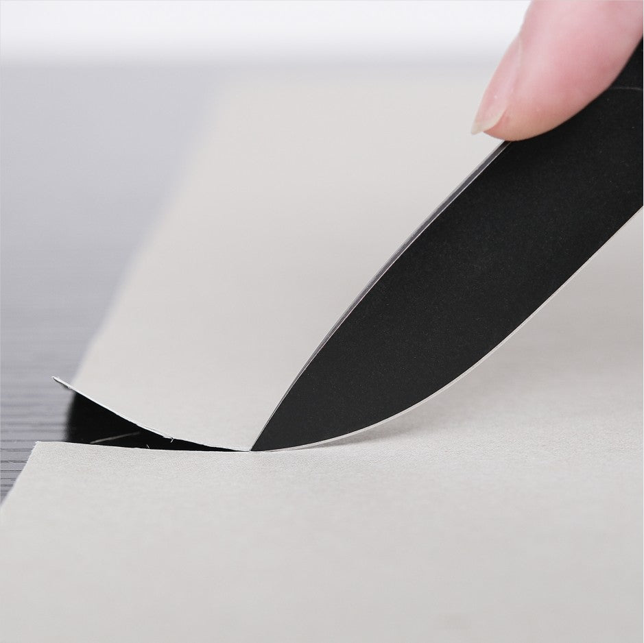 Mini Labrador knife cutting paper
