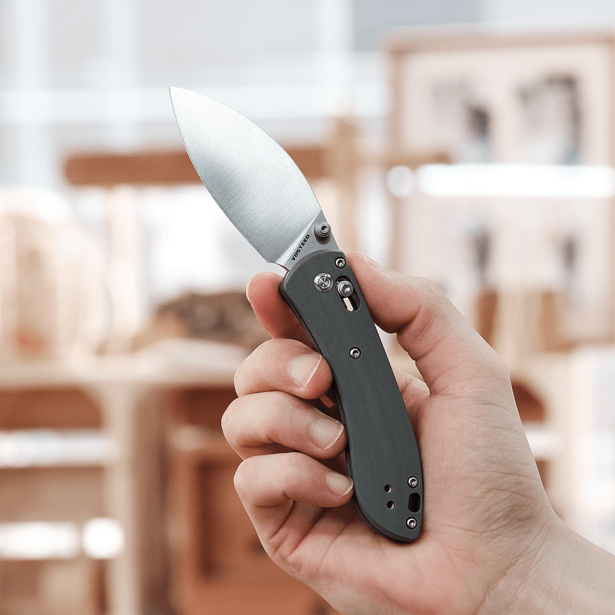 Vosteed Mini Nightshade knife held in hand, blade open