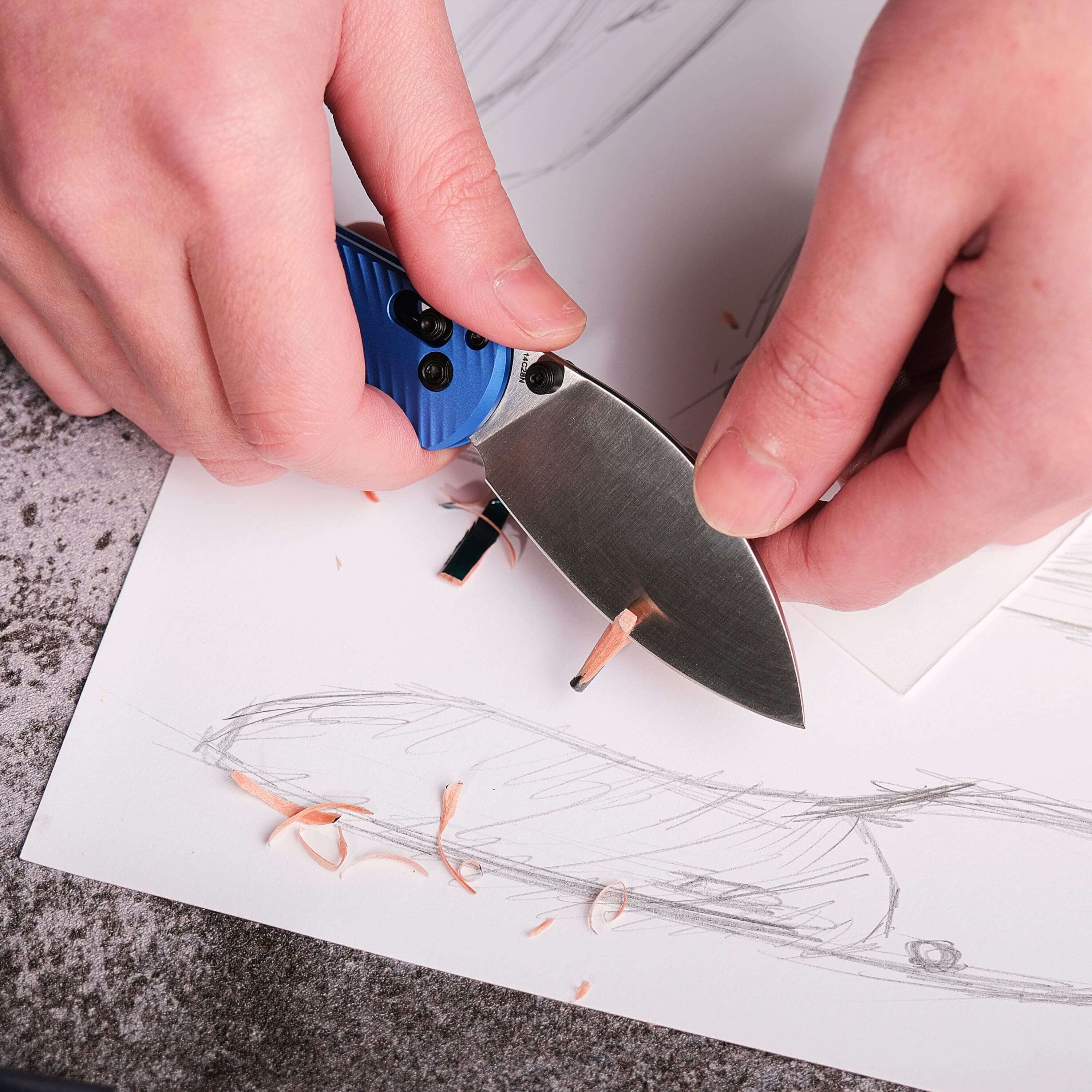 Mini Nightshade knife blade sharpening a pencil on drawing