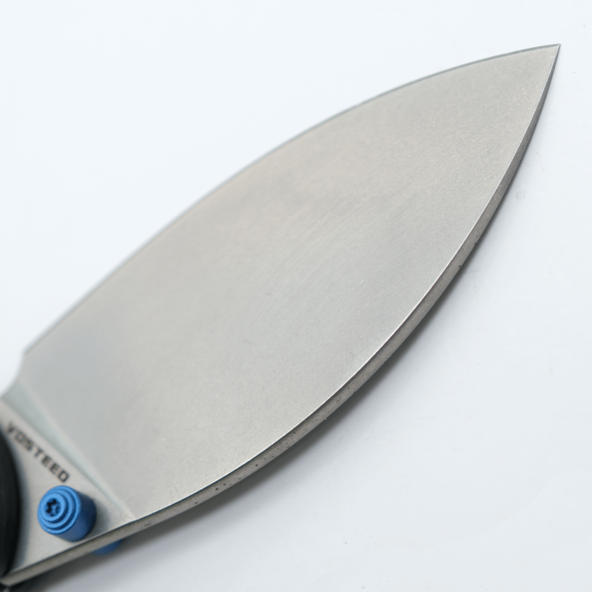 Close-up of Vosteed Mini Nightshade knife blade, S35VN steel.
