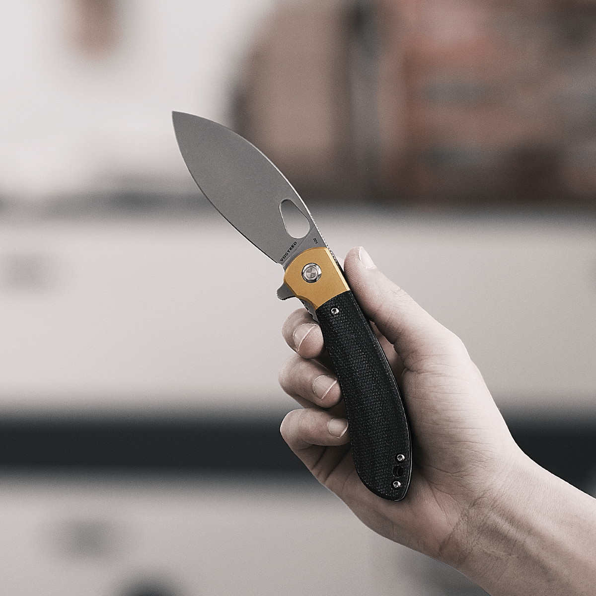 Vosteed Nightshade knife held in hand - Elmax blade