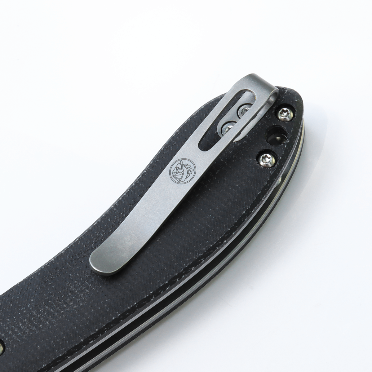 Nightshade knife detail: titanium pocket clip, black Micarta handle