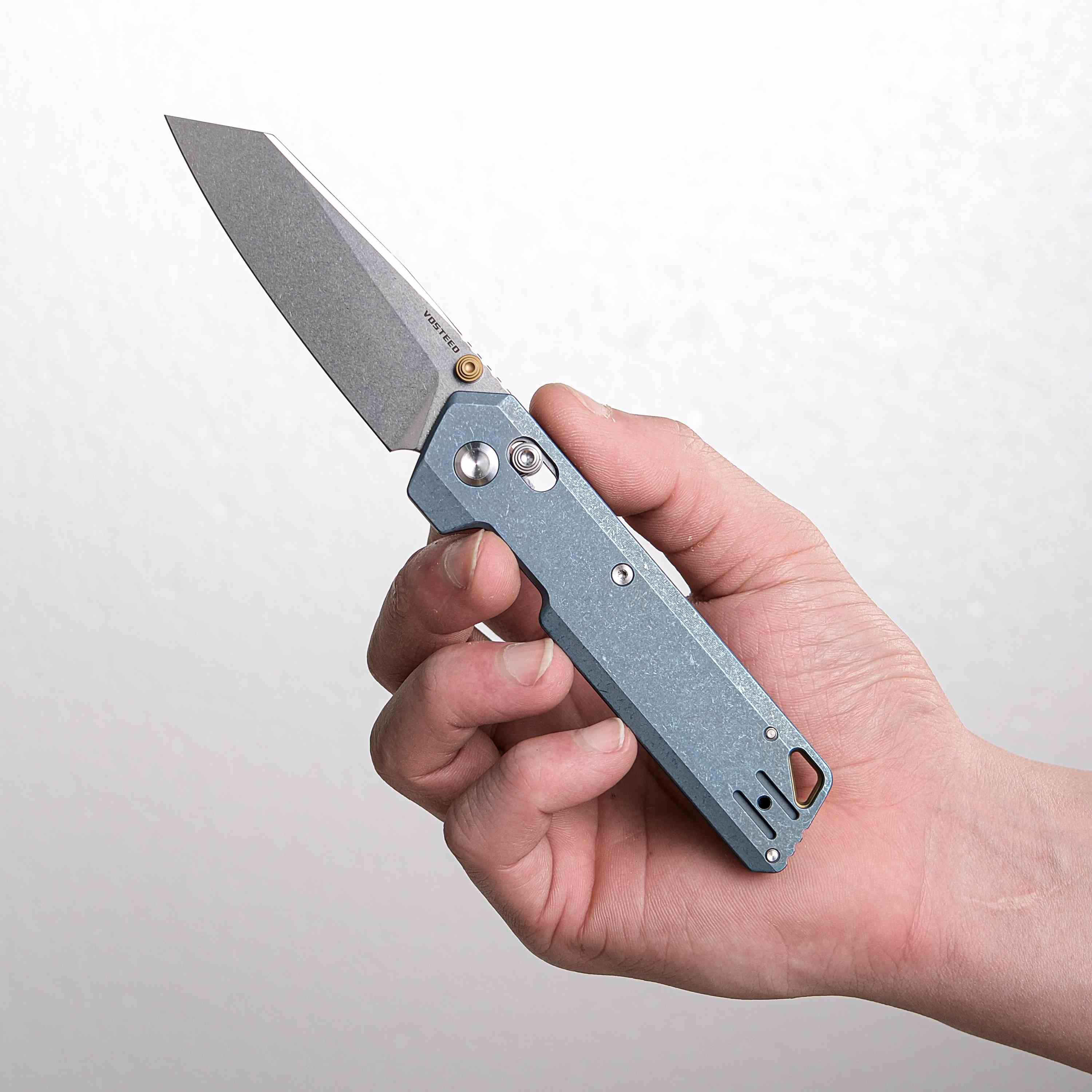 Vosteed Parallel knife in hand, S35VN blade, blue titanium handle
