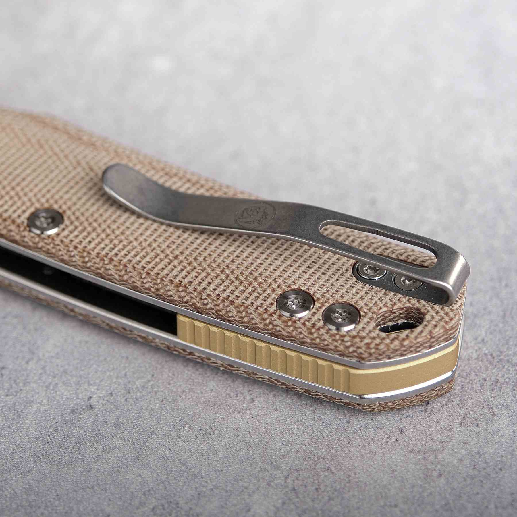 Vosteed Psyop knife pocket clip detail, natural Micarta handle