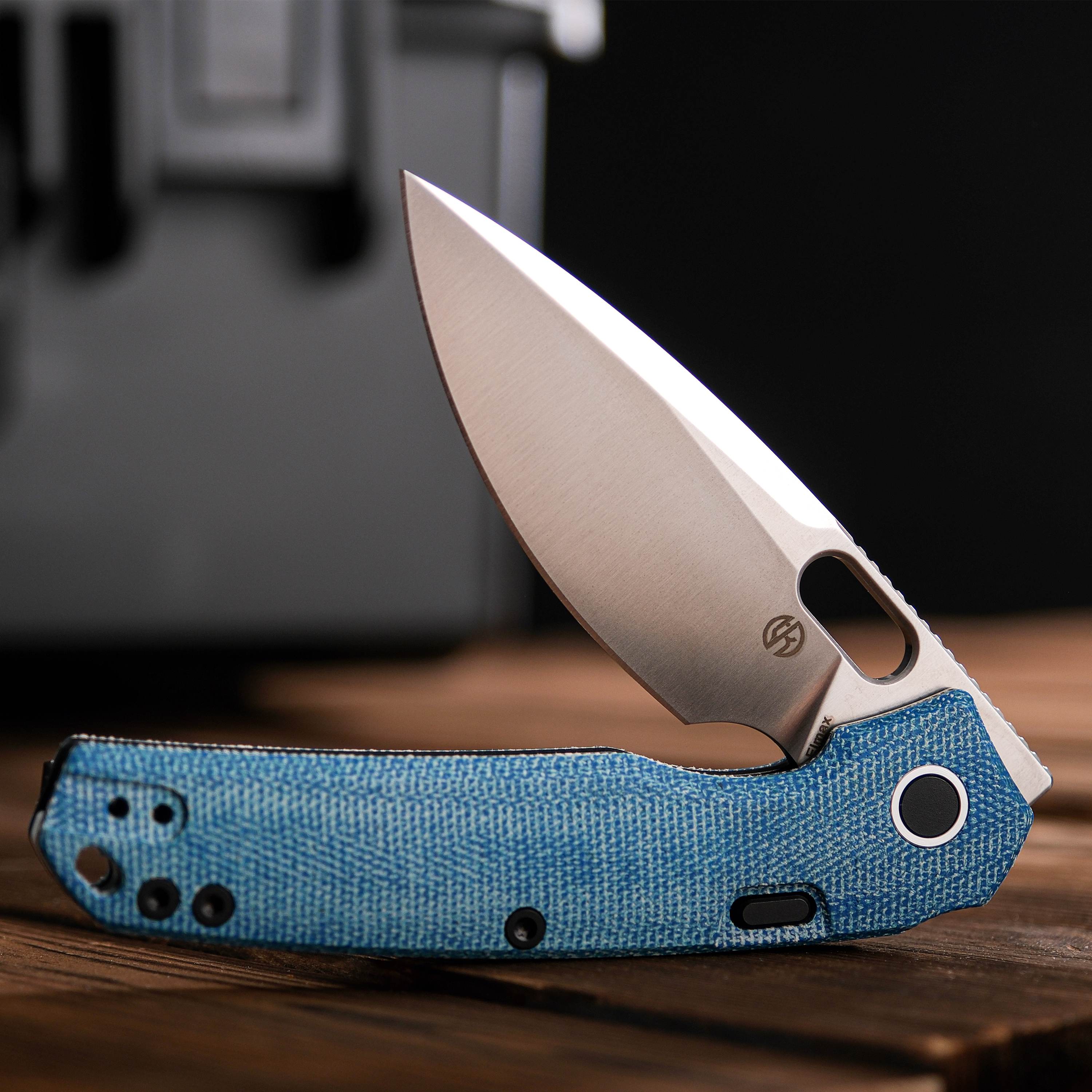 Vosteed Psyop knife with blue Micarta handle, top liner lock open